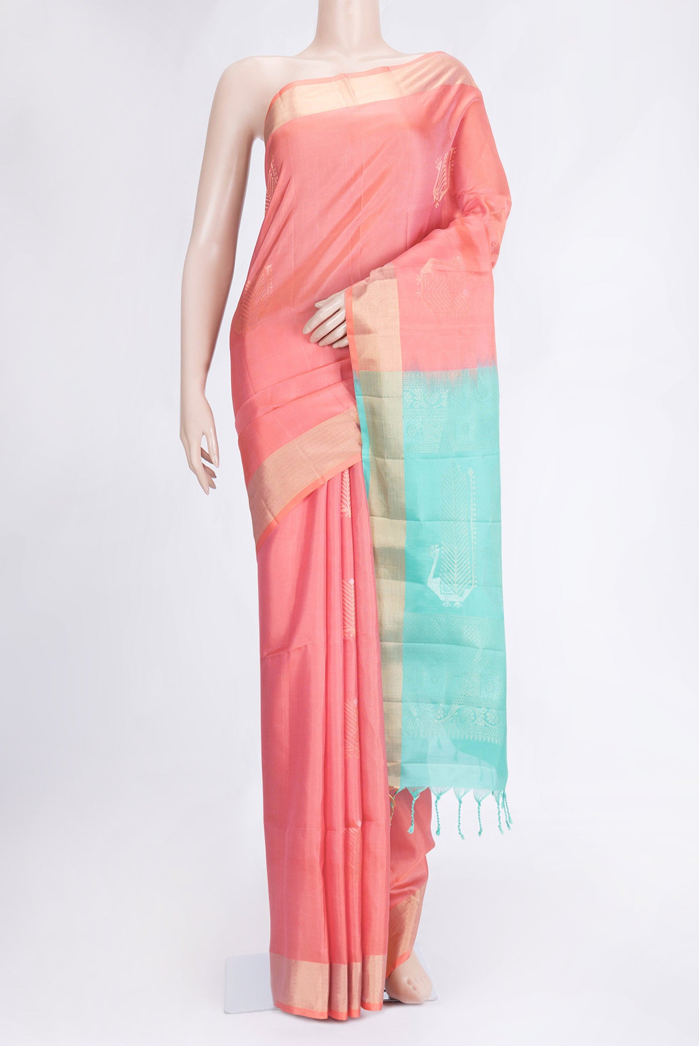 Peach Dual Tone Soft Silk Saree with Zari Butta on the body and Zari Border.  displayed on a mannequin