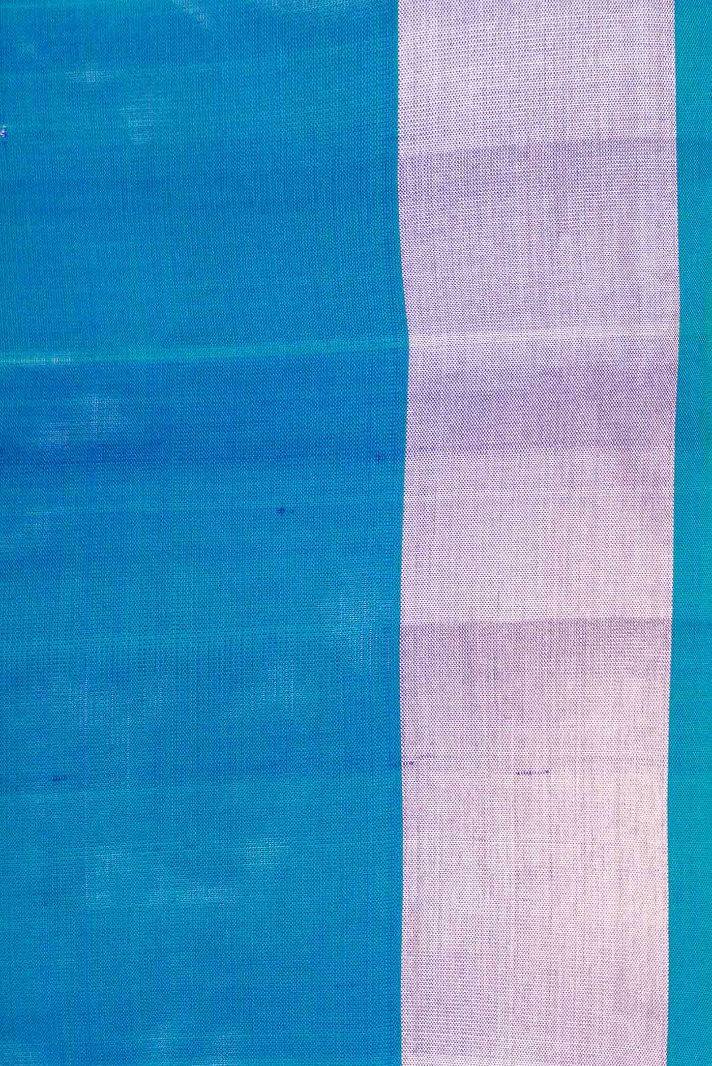 Border image of Peacock Blue Dual Tone Soft Silk Saree with Zari Butta on the body and Zari Border. 