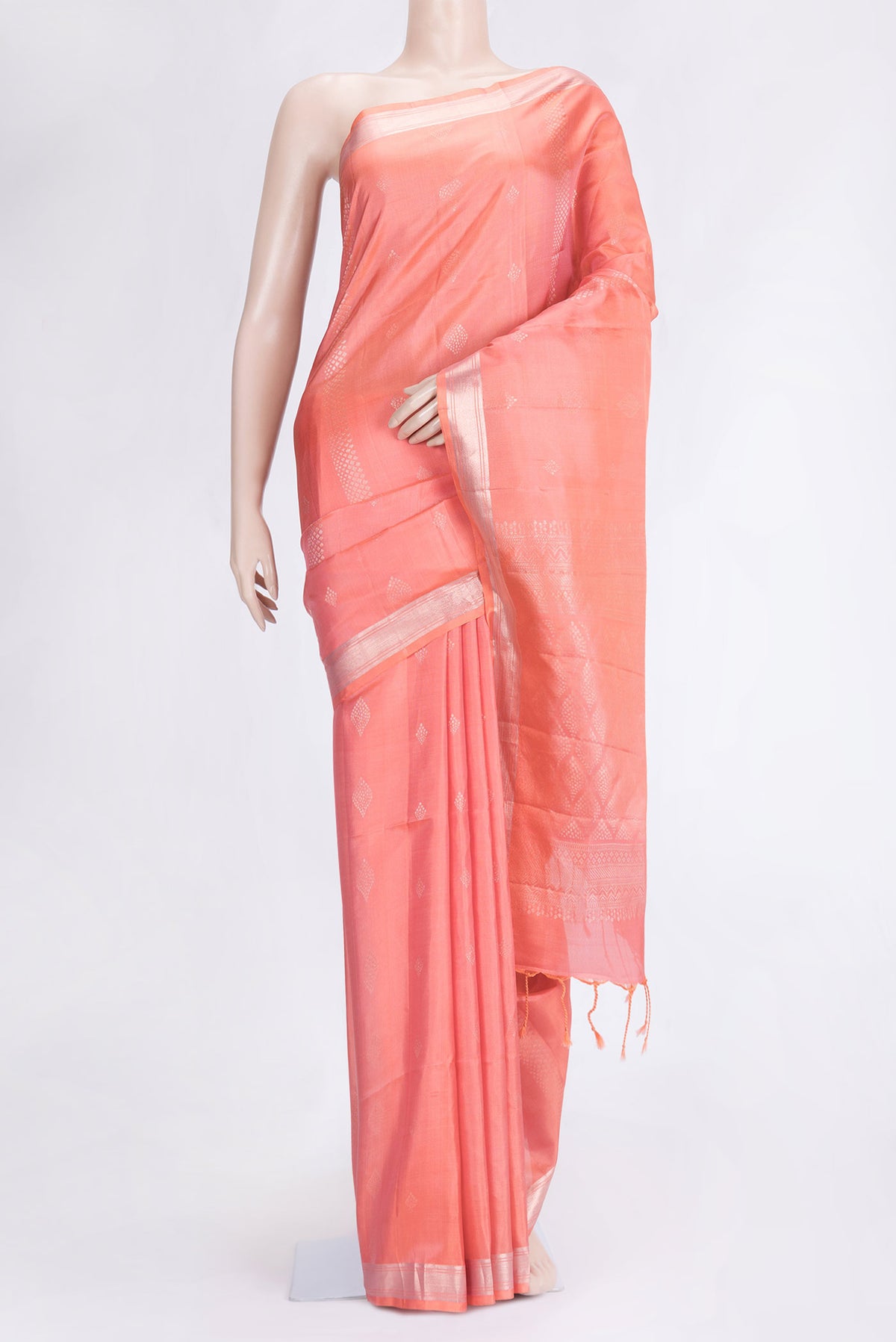 Peach Dual Tone Soft Silk Saree with Zari Butta on the body and Zari Border.  displayed on a mannequin