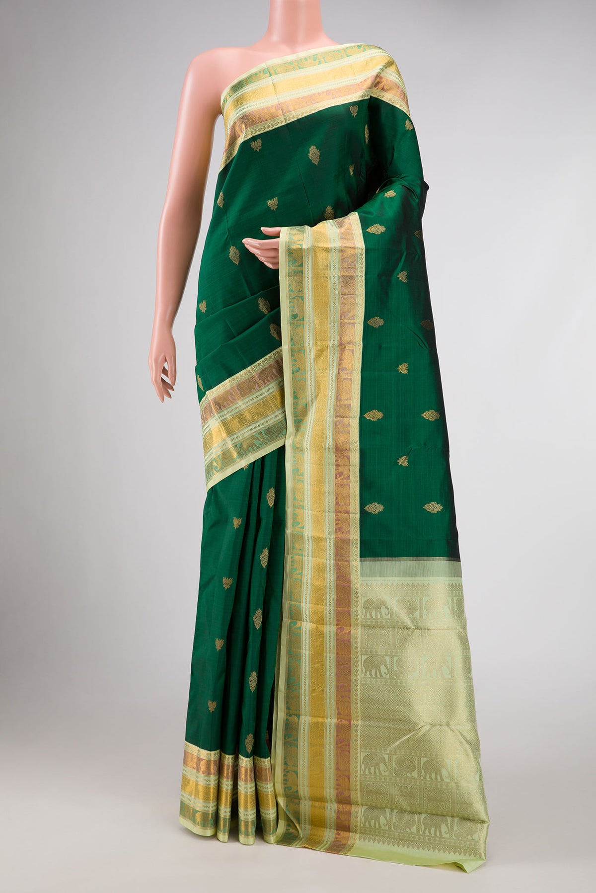 Pure Silk Pure Zari Bottle Green Dual Tone Kanchipuram Saree with Zari Butta on the body and Zari Border displayed on a mannequin