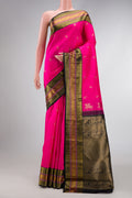 Pink Dual Tone Kanchipuram Silk Saree with Zari Butta on the body and Zari Border.  displayed on a mannequin