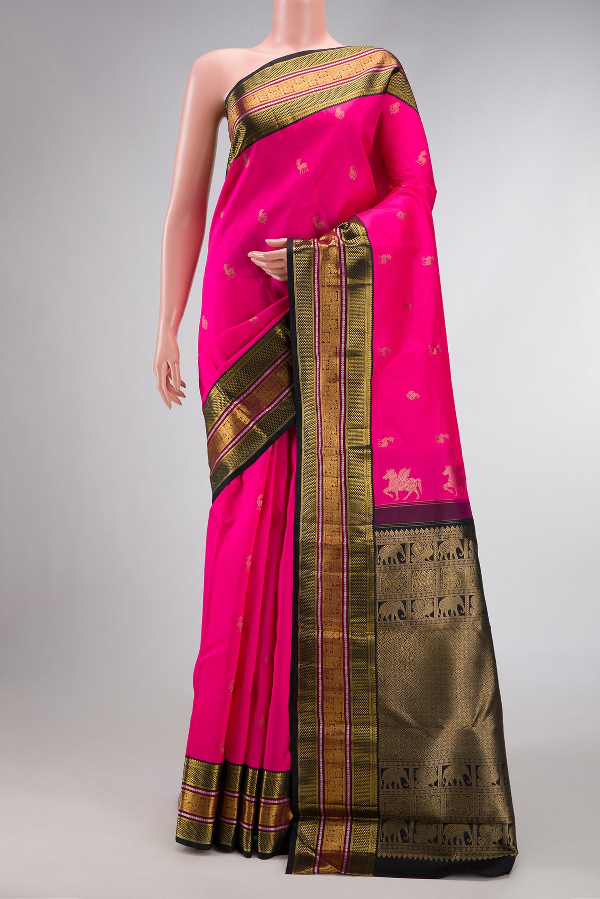 Pink Dual Tone Kanchipuram Silk Saree with Zari Butta on the body and Zari Border.  displayed on a mannequin