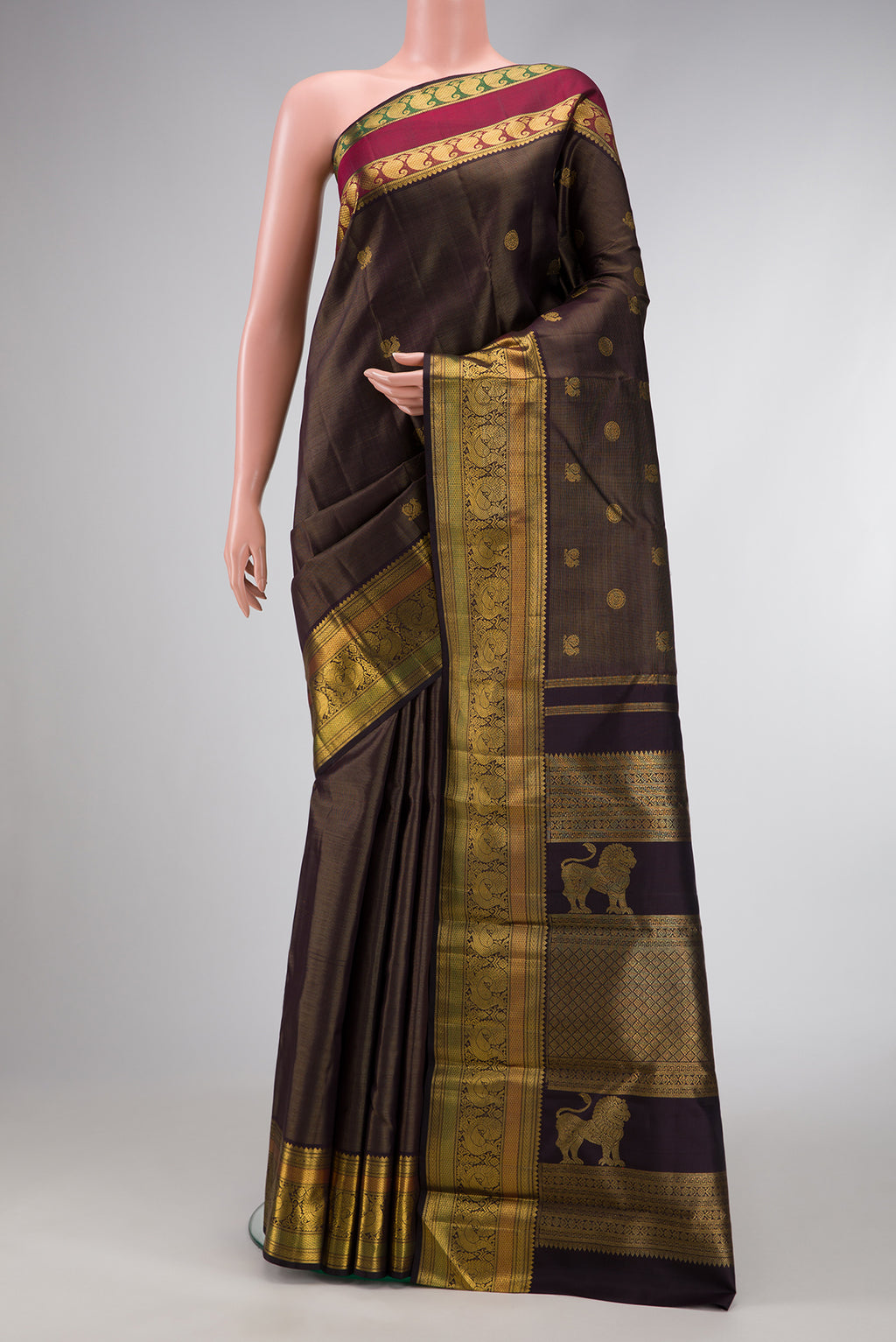Pure Silk Pure Zari Brown Dual Tone Kanchipuram Saree with Zari Butta on the body and Zari Border.  displayed on a mannequin