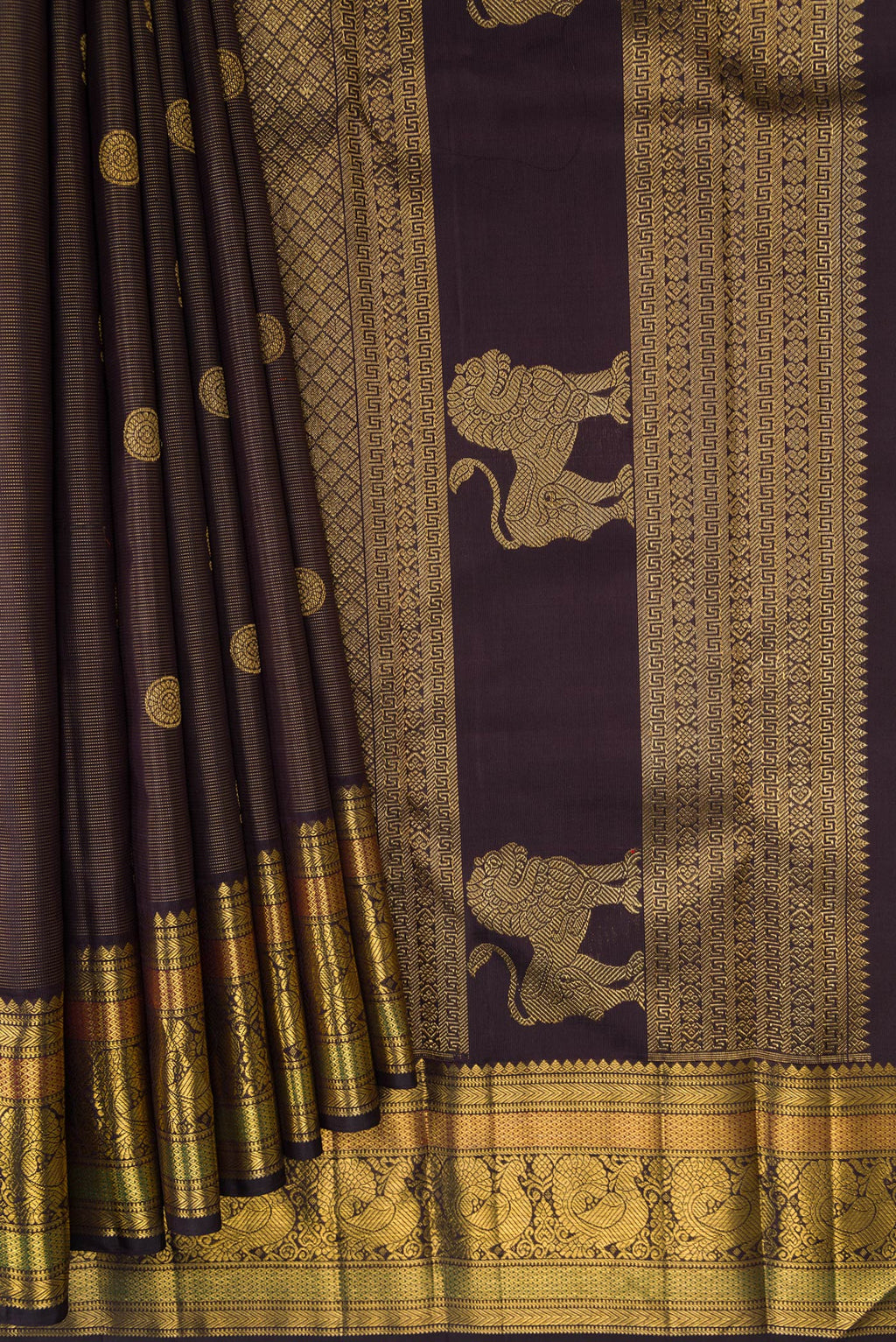 Pleats and pallu of Pure Silk Pure Zari Brown Dual Tone Kanchipuram Saree with Zari Butta on the body and Zari Border. 