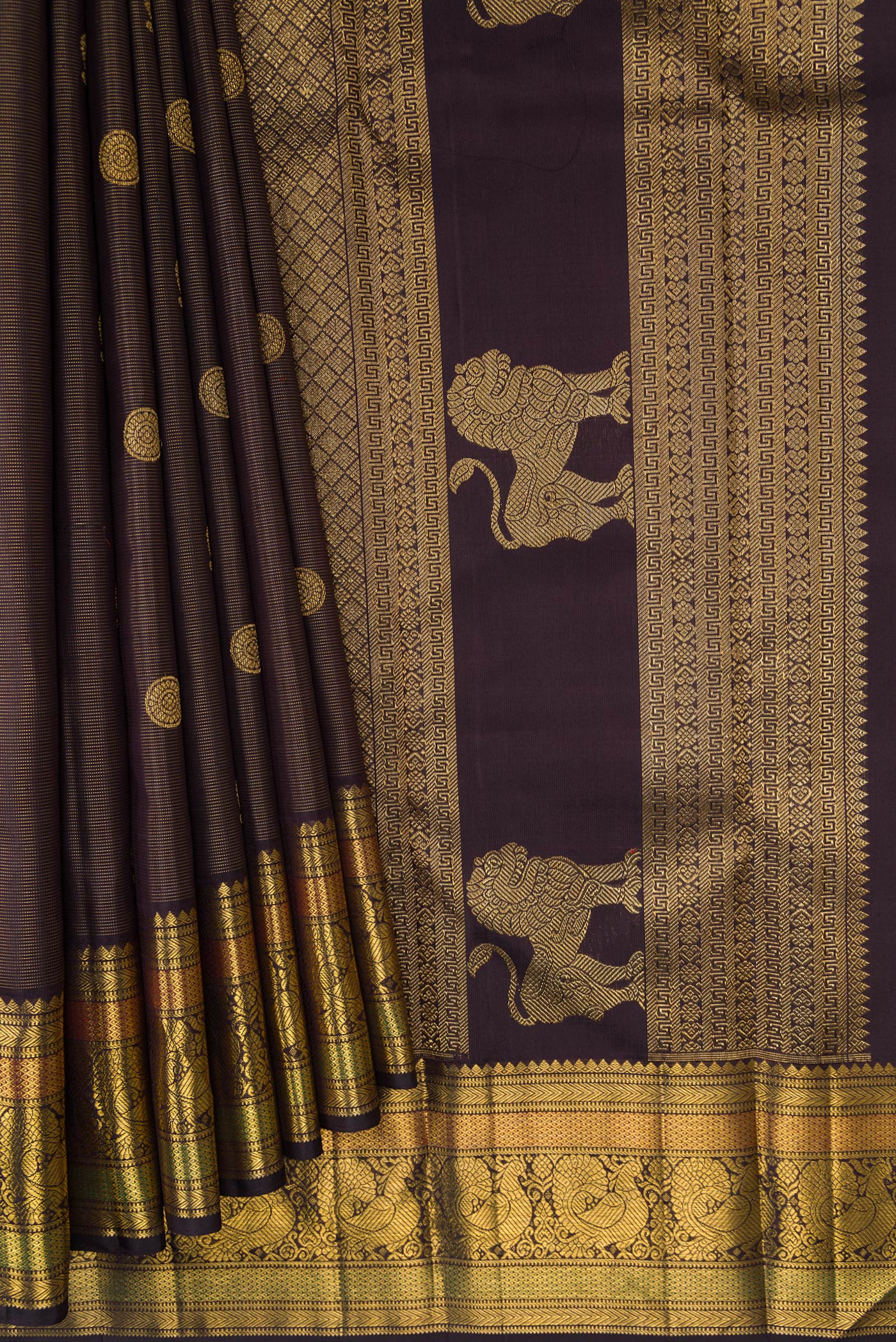 Pleats and pallu of Pure Silk Pure Zari Brown Dual Tone Kanchipuram Saree with Zari Butta on the body and Zari Border. 