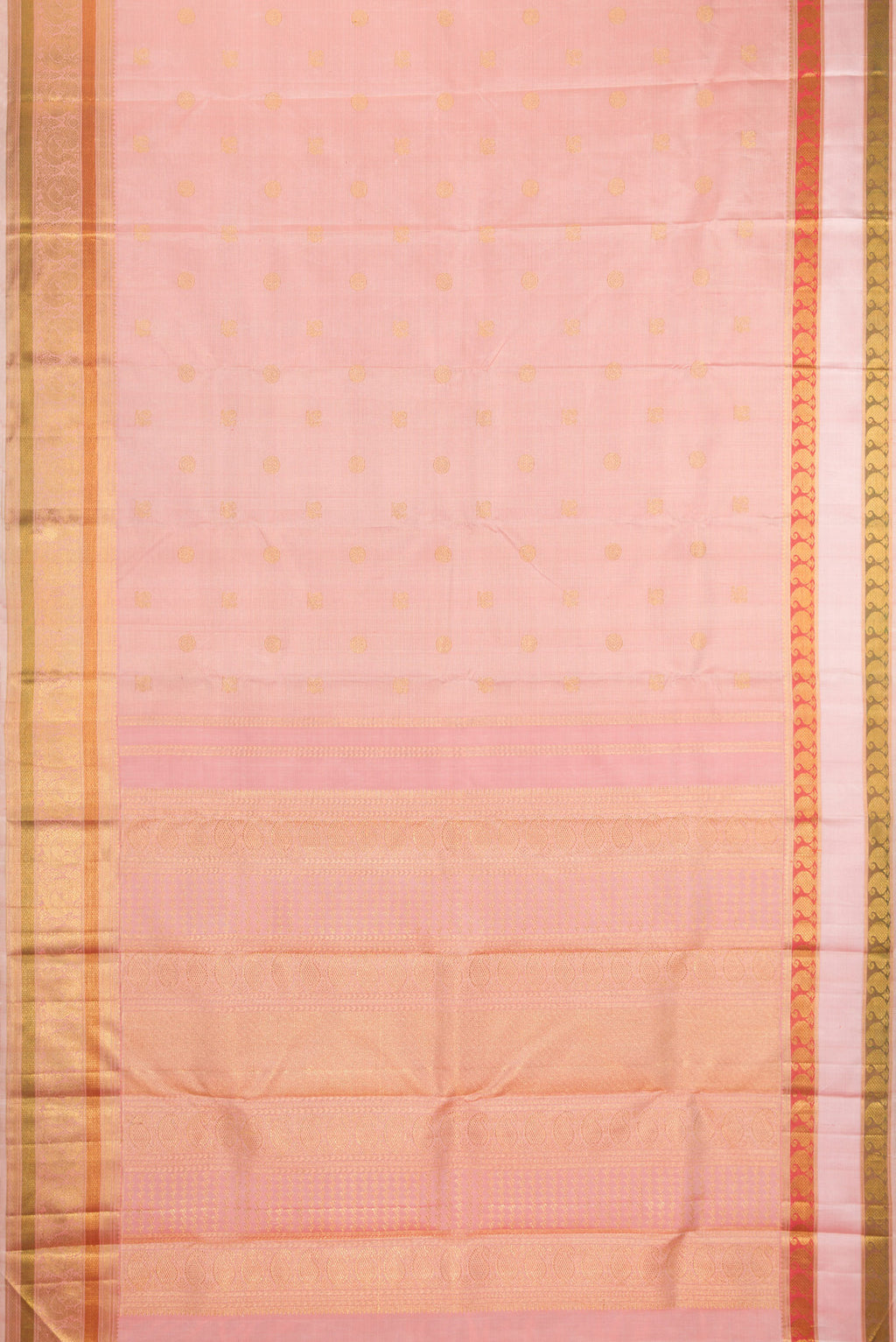 Flat view of Peach Kanchipuram Silk Saree with Zari Butta on the body and Zari And Thread Border. 