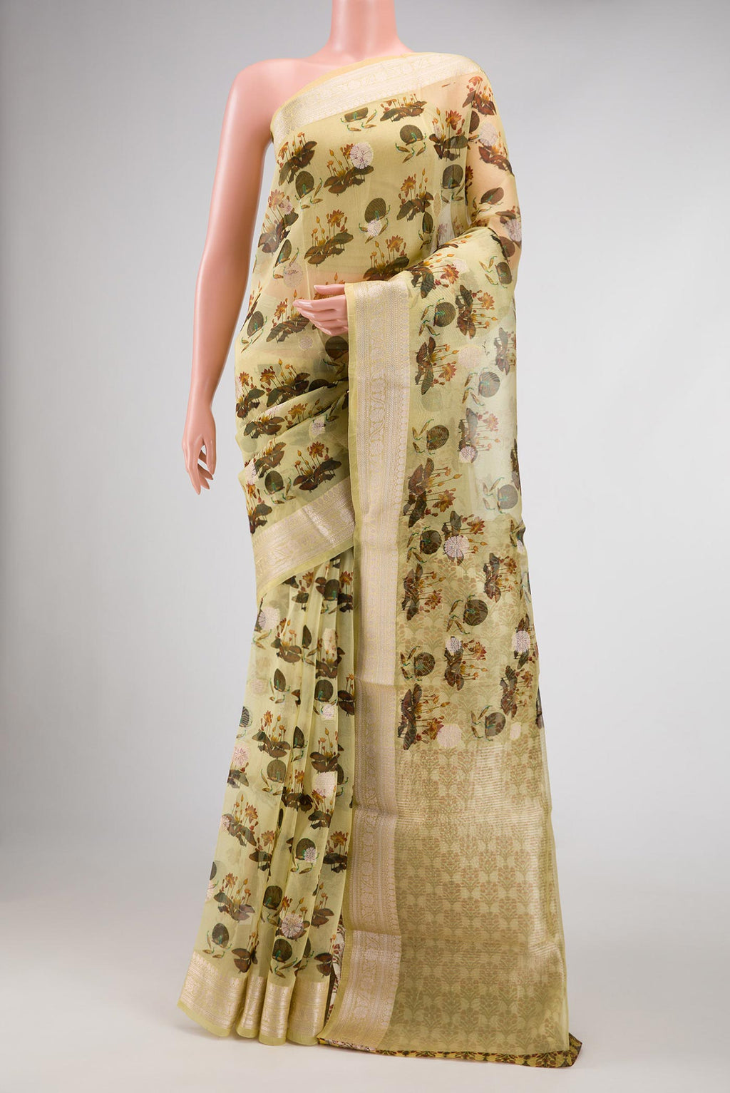 Green Dual Tone Organza Silk Saree with Printed design on the body and Zari Border.  displayed on a mannequin