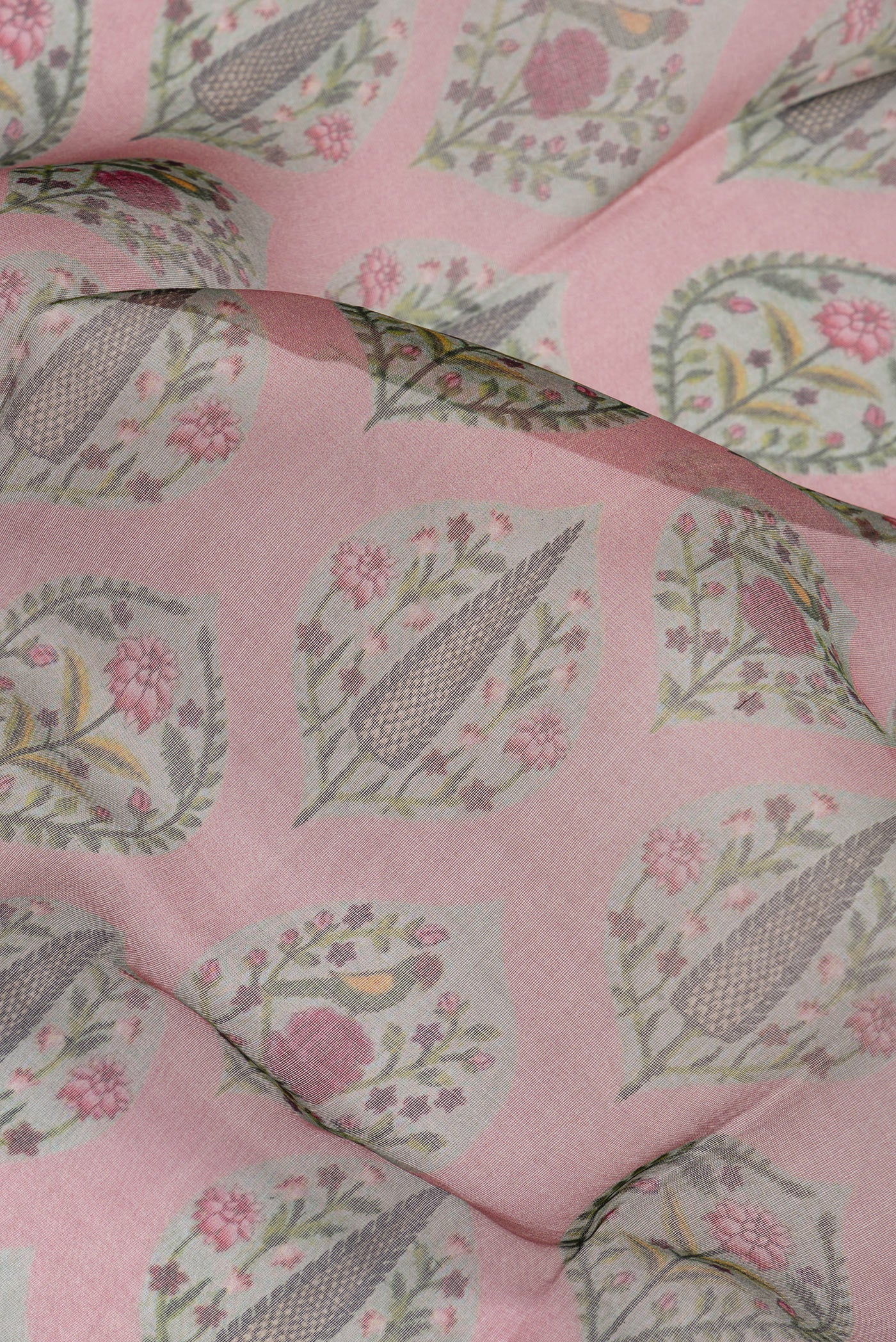 Close up of Mauve Organza Silk Saree with Printed design on the body and Zari Border.  displaying folds
