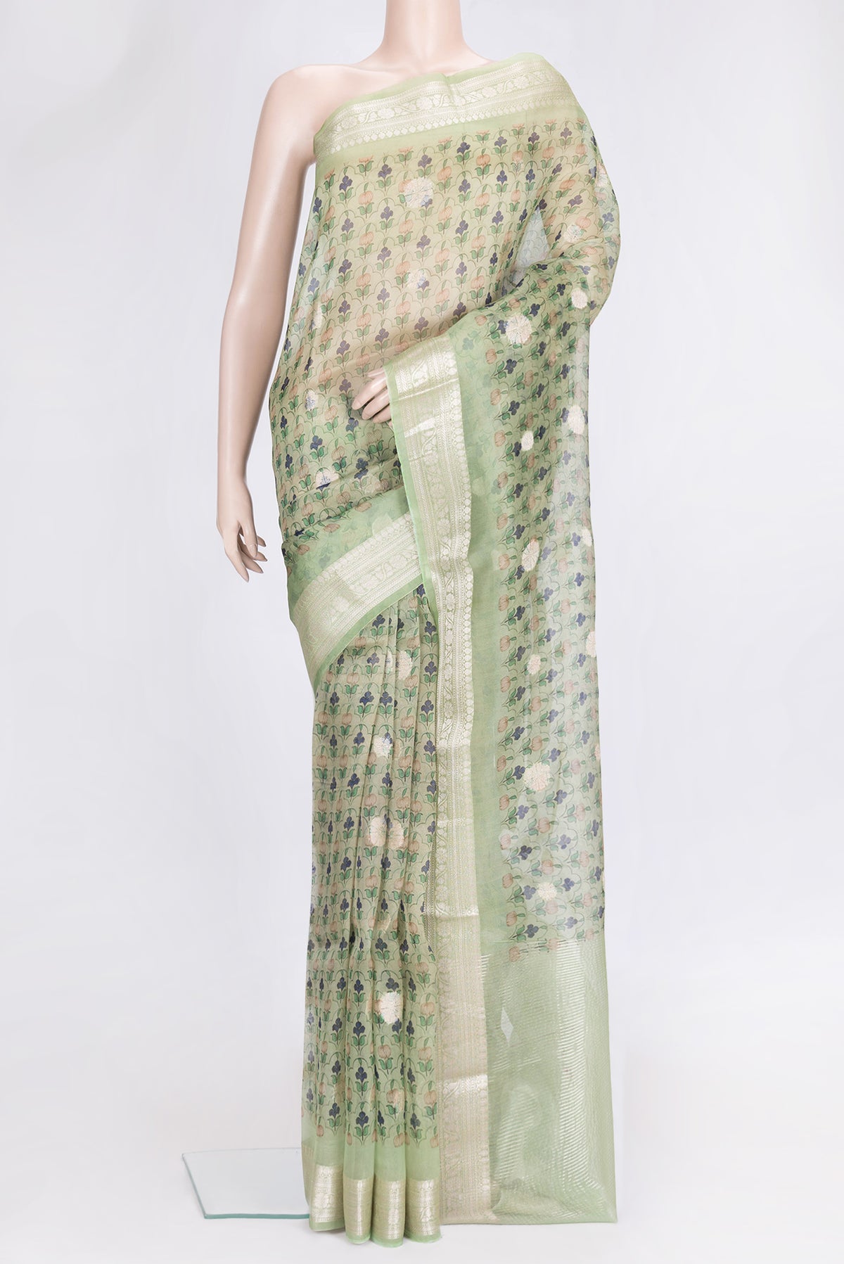 Pista Green Dual Tone Organza Silk Saree with Printed design on the body and Zari Border.  displayed on a mannequin