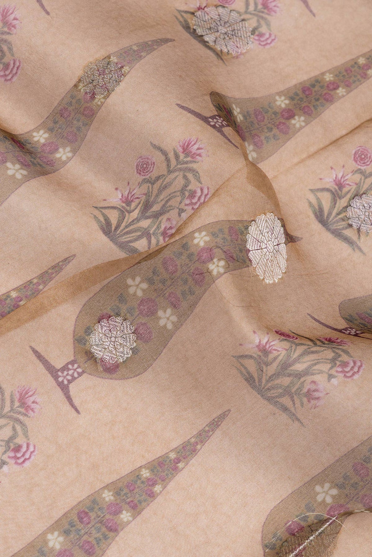 Close up of Brown Organza Silk Saree with Zari Butta on the body and Zari Border.  displaying folds