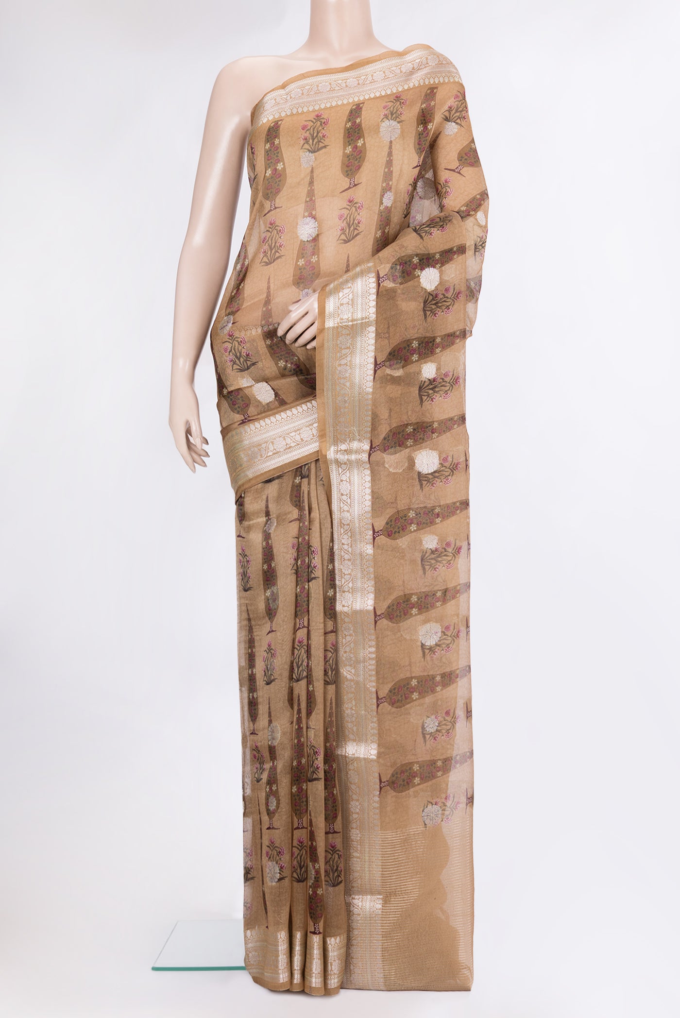 Brown Organza Silk Saree with Zari Butta on the body and Zari Border.  displayed on a mannequin