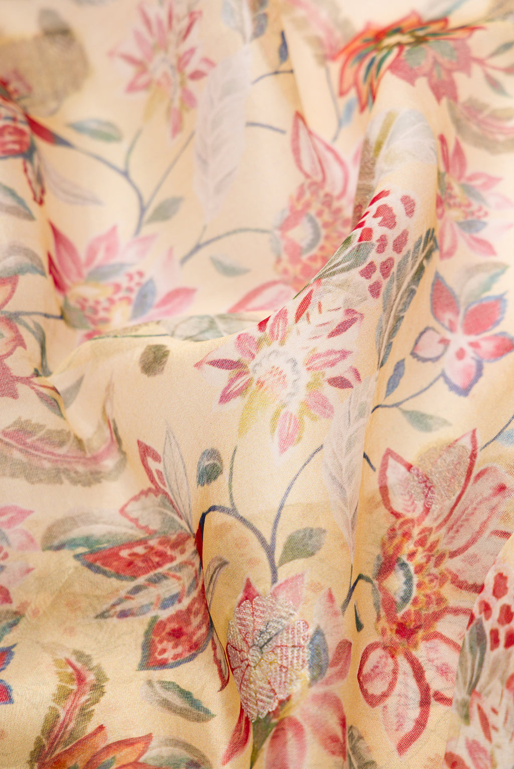 Close up of Sandal Dual Tone Organza Silk Saree with Printed design on the body and Zari Border.  displaying folds