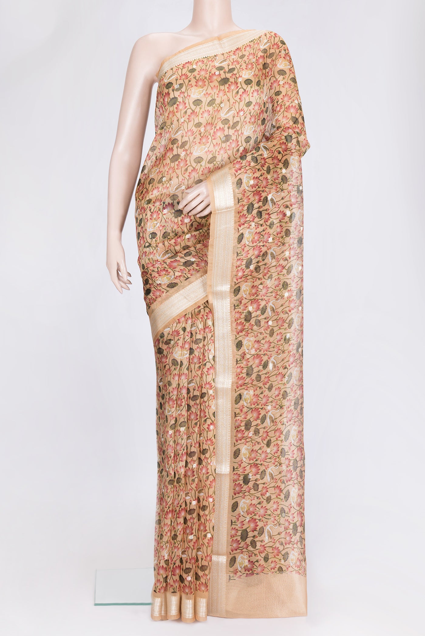 Peach Dual Tone Organza Silk Saree with Printed design on the body and Zari Border.  displayed on a mannequin