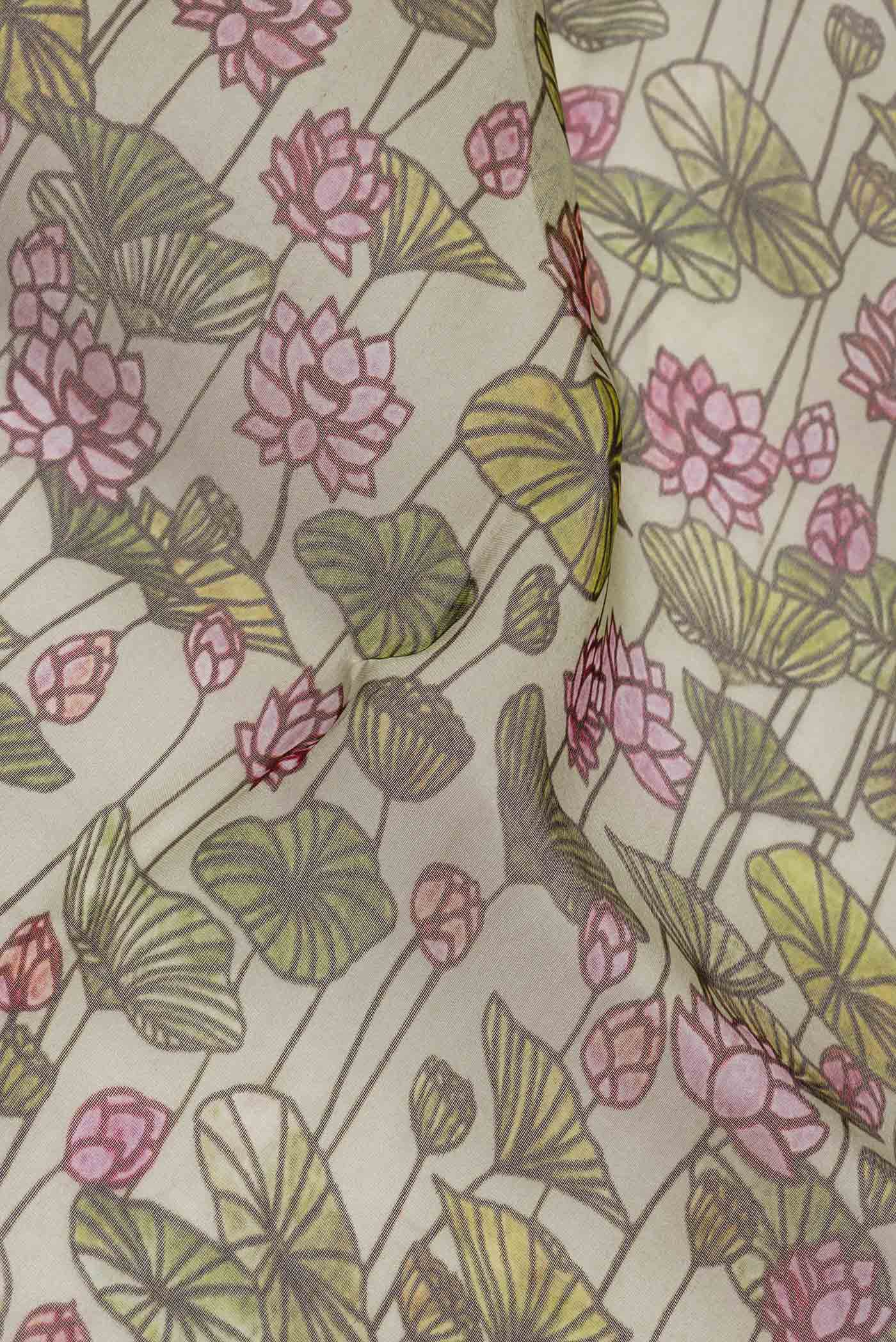 Close up of Beige Dual Tone Organza Silk Saree with Printed design on the body and Zari Border.  displaying folds