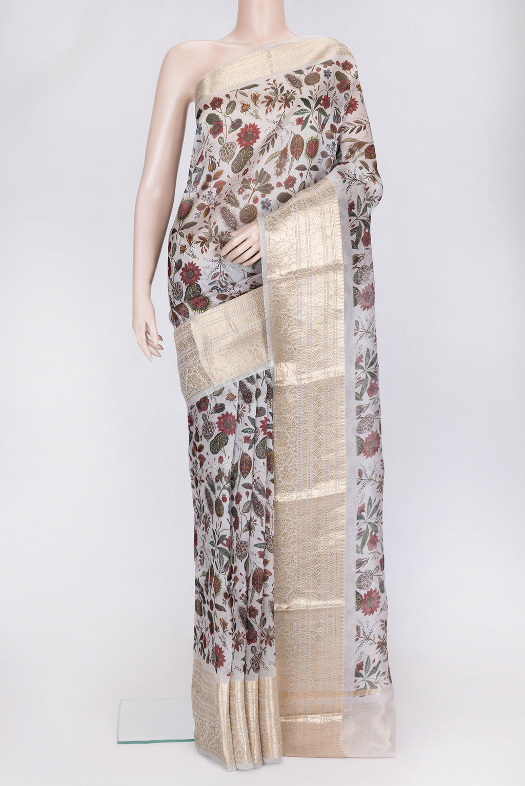 Grey Dual Tone Organza Silk Saree with Printed design on the body and Zari Border.  displayed on a mannequin