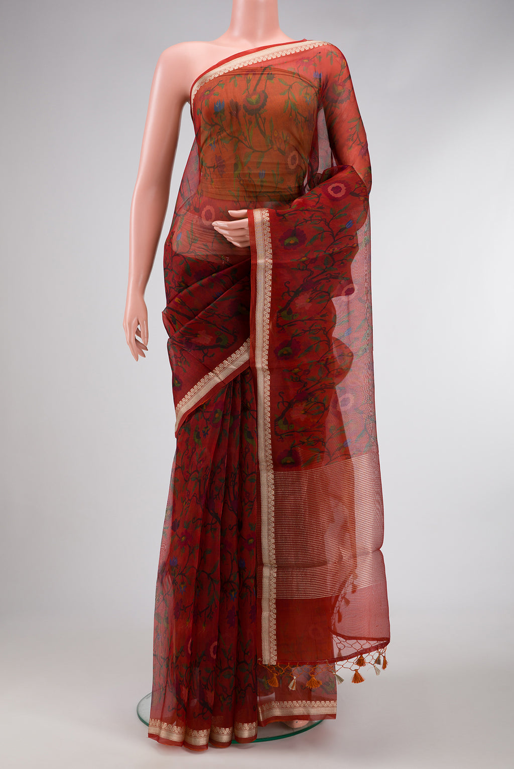 Maroon Dual Tone Organza Silk Saree with Printed design on the body and Zari Border.  displayed on a mannequin