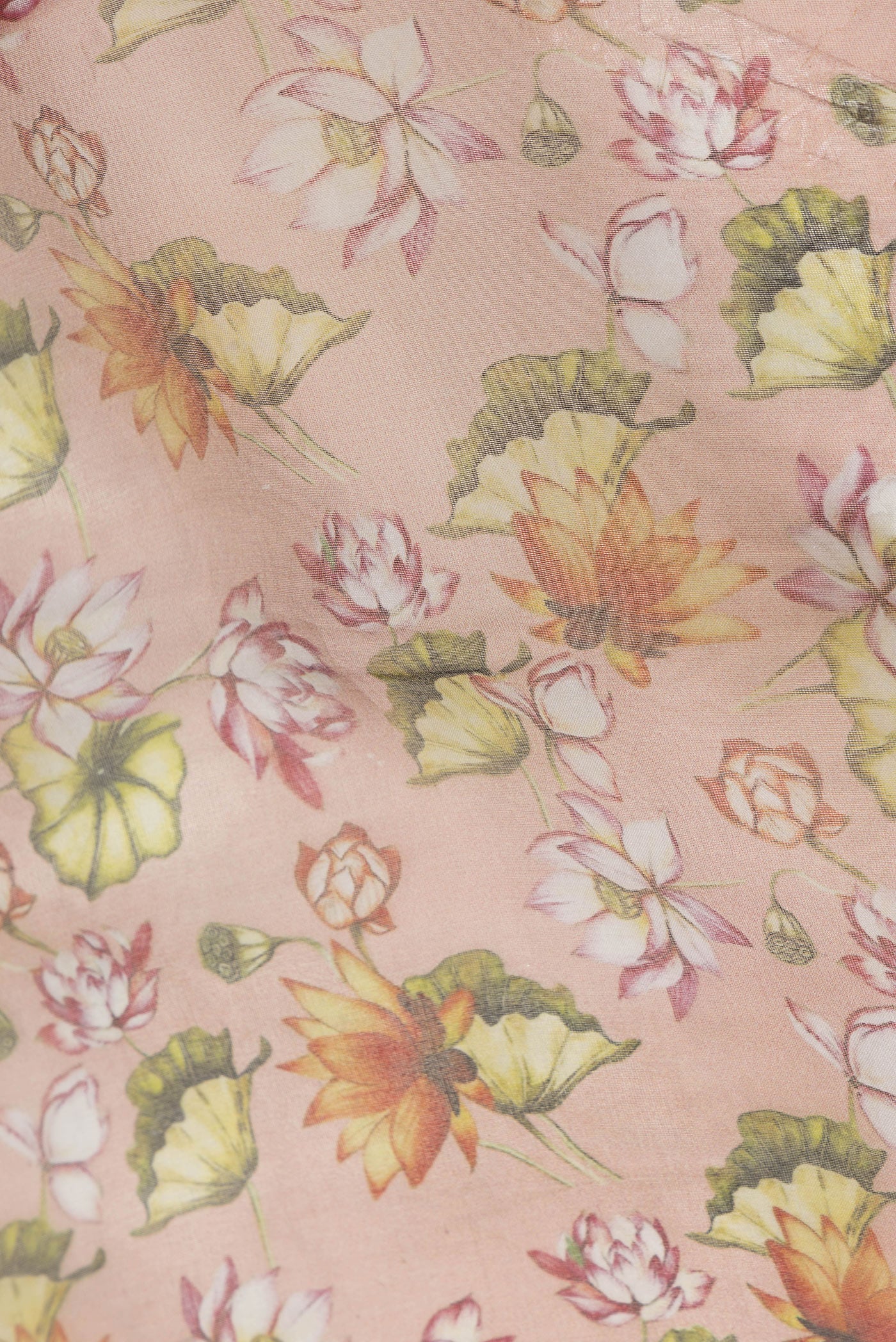 Close up of Orange Dual Tone Organza Silk Saree with Printed design on the body and Zari Border.  displaying folds