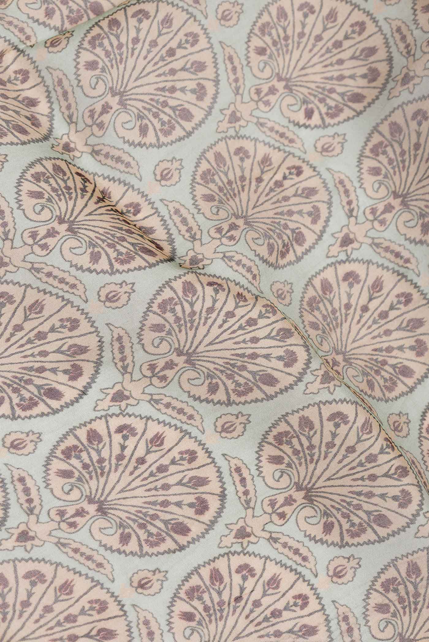 Close up of Beige Dual Tone Organza Silk Saree with Printed design on the body and Zari Border.  displaying folds