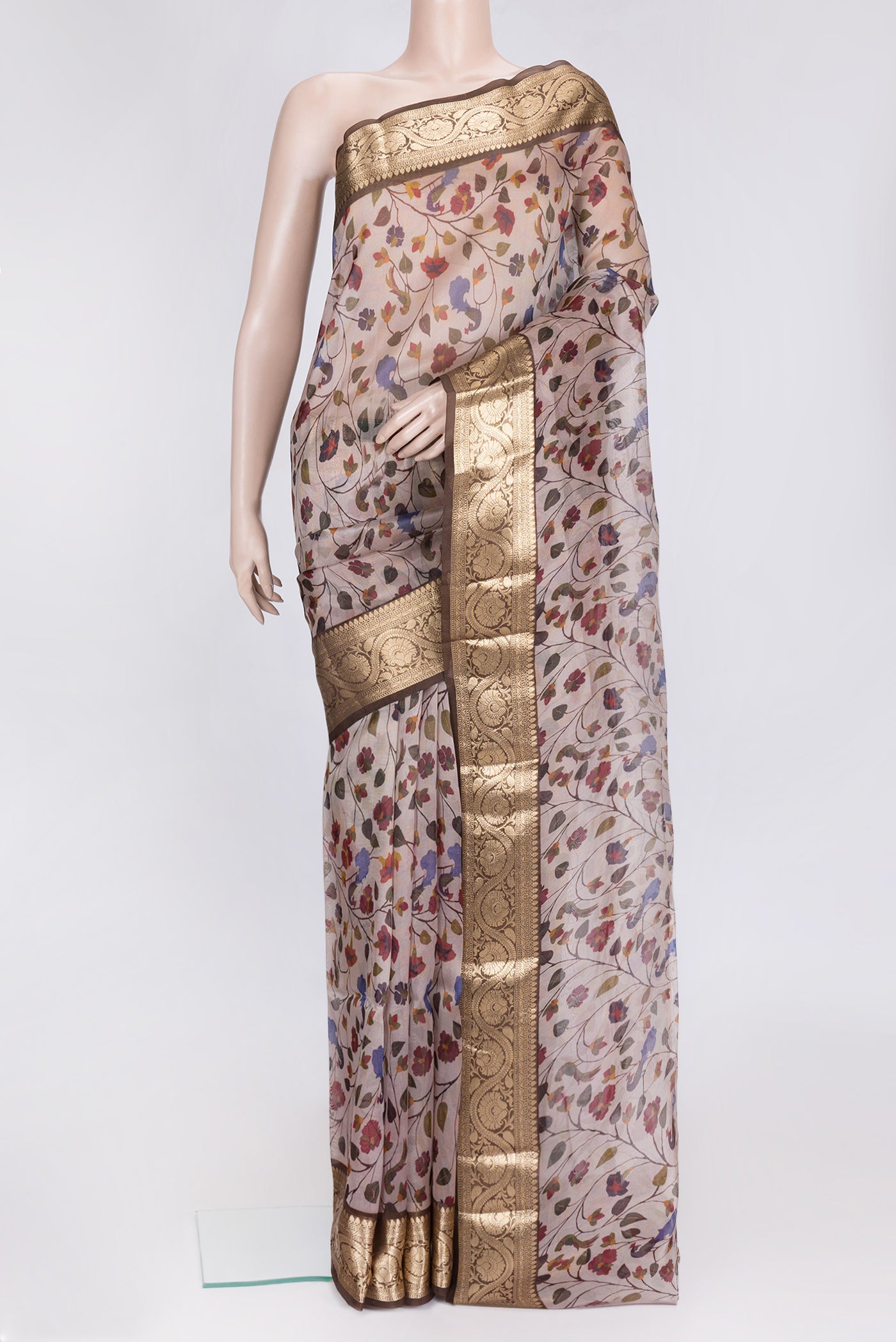 Rose Gold Dual Tone Organza Silk Saree with Printed design on the body and Zari Border.  displayed on a mannequin