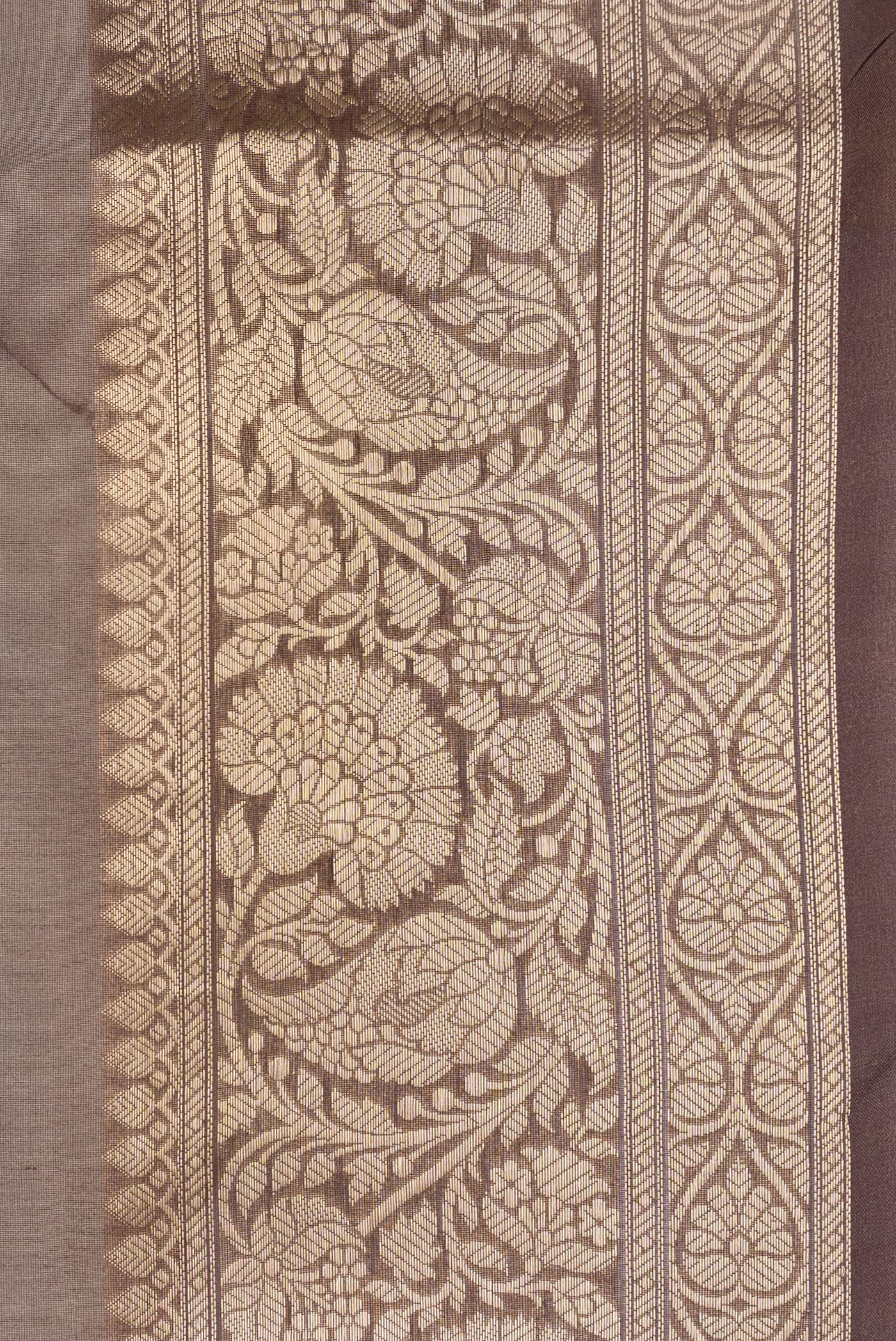 Border image of Brown Dual Tone Organza Silk Saree with Printed design on the body and Zari Border. 