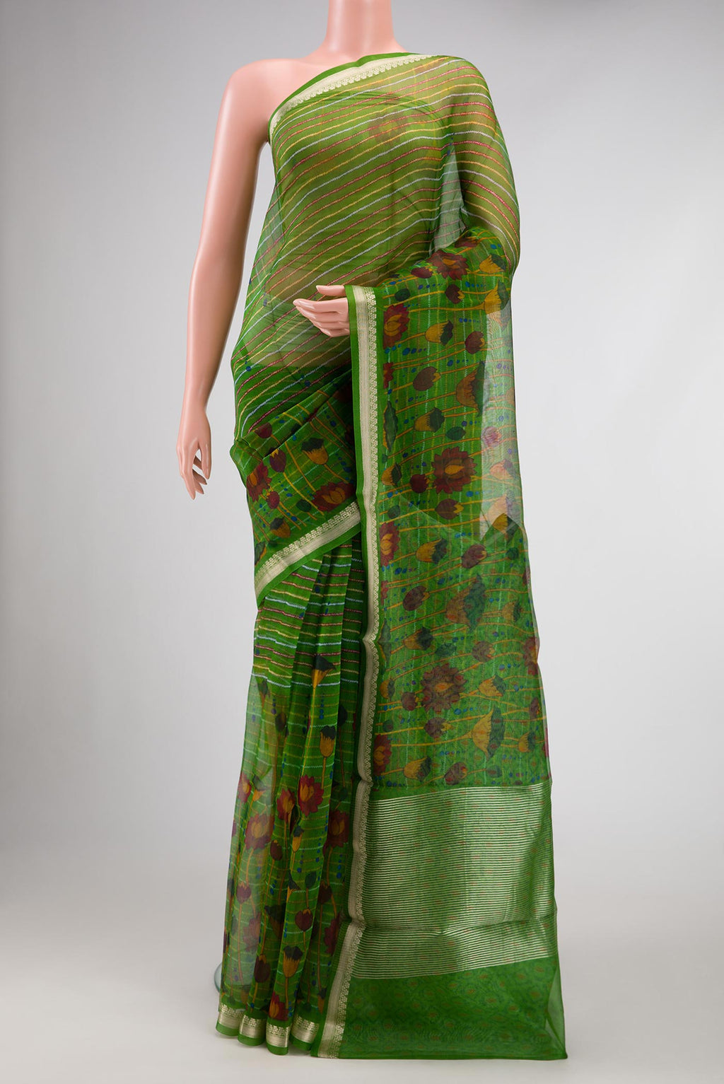 Green Dual Tone Organza Silk Saree with Printed design on the body and Zari Border.  displayed on a mannequin