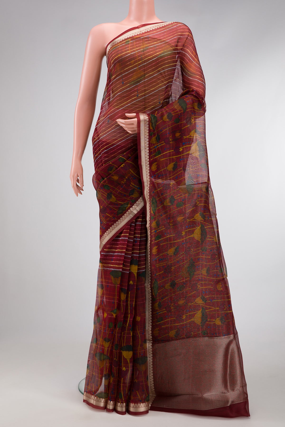 Maroon Dual Tone Organza Silk Saree with Printed design on the body and Zari Border.  displayed on a mannequin