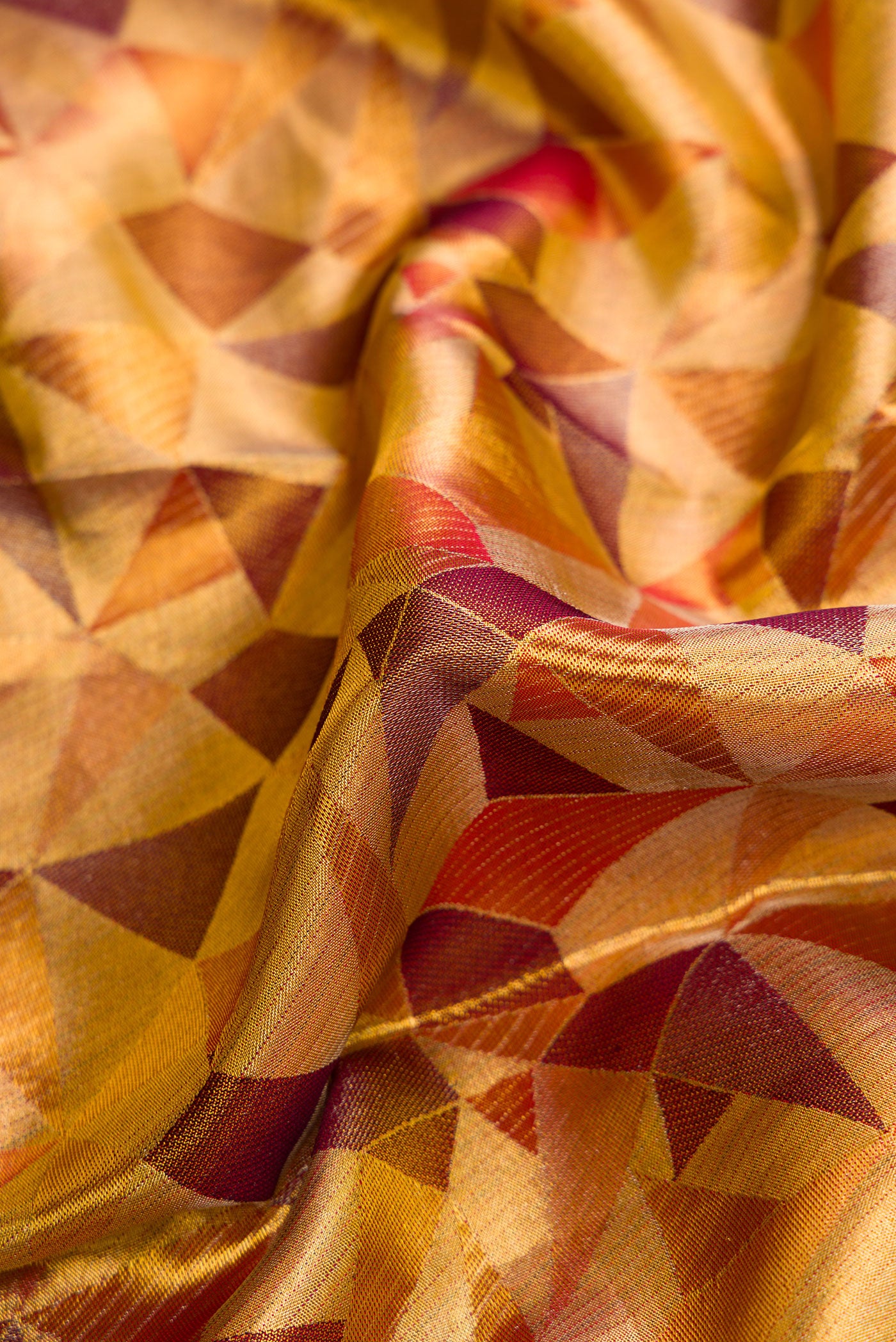 Close up of Gold Dual Tone Kanjivaram Tissue Silk Saree with Zari Brocade on the body and Zari Border.  displaying folds