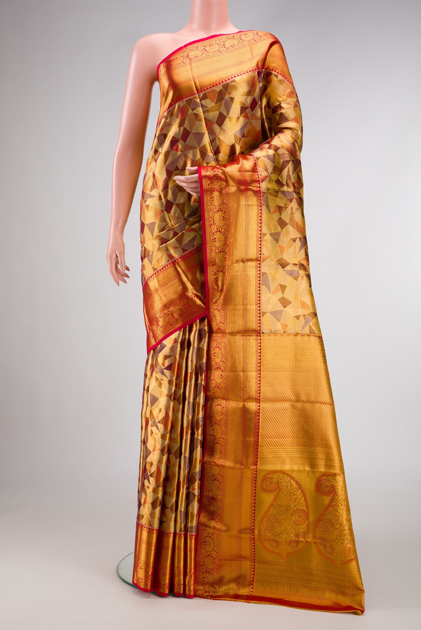 Gold Dual Tone Kanjivaram Tissue Silk Saree with Zari Brocade on the body and Zari Border.  displayed on a mannequin