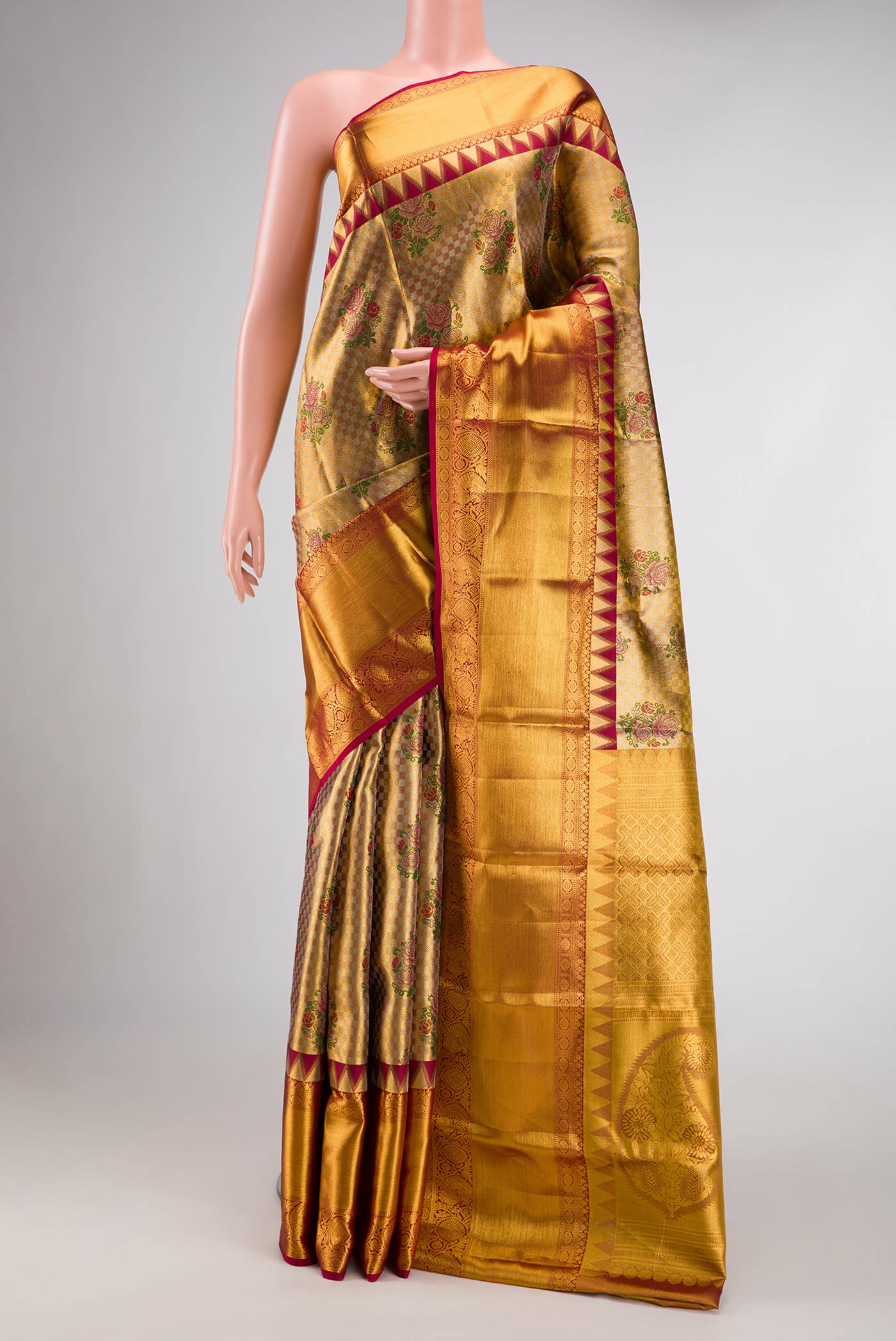 Gold Dual Tone Kanjivaram Tissue Silk Saree with Zari Brocade on the body and Zari Border.  displayed on a mannequin