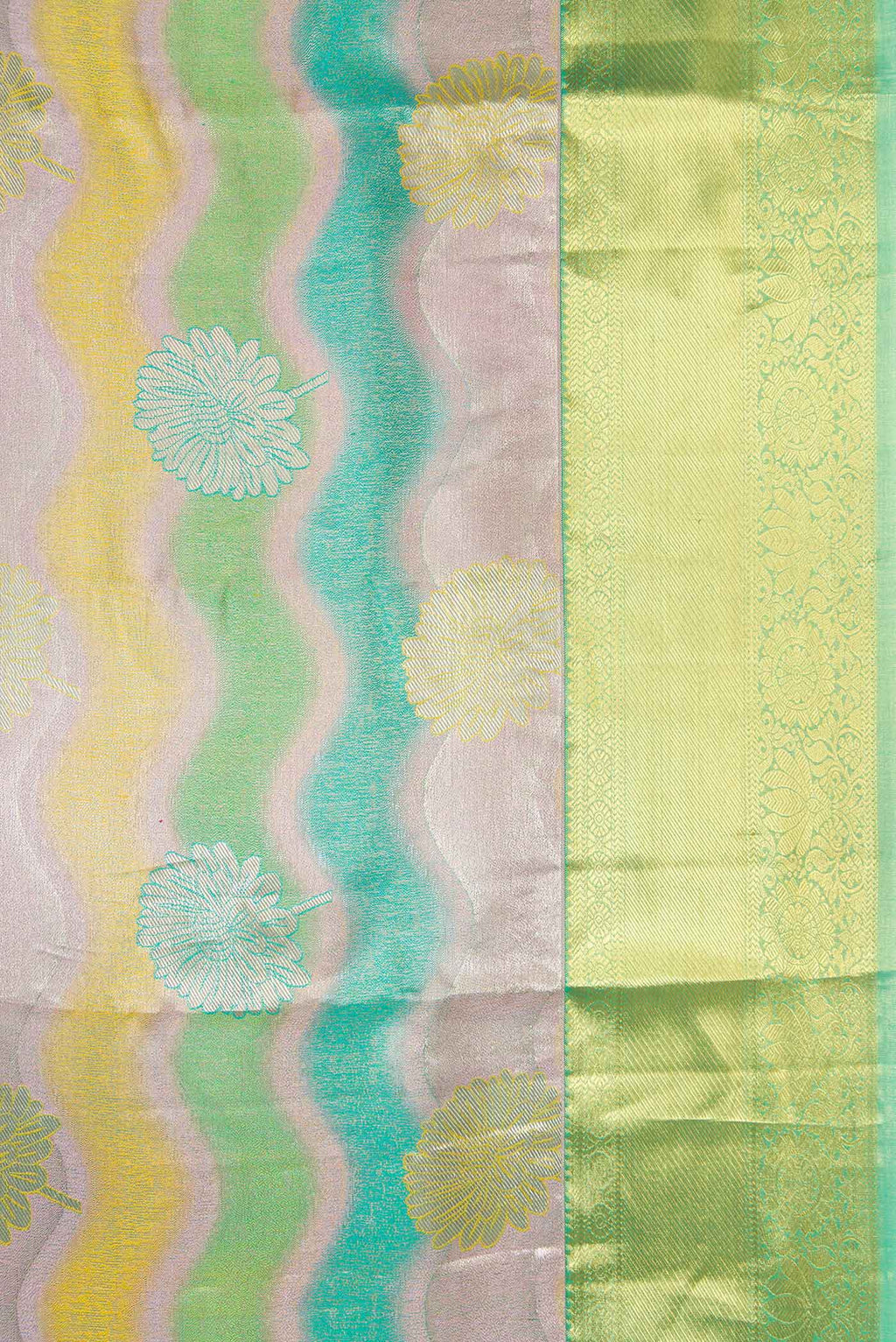 Border image of Green and Lavender Color Kanjivaram Tissue Silk Saree with Zari Brocade on the body and Zari Border. 