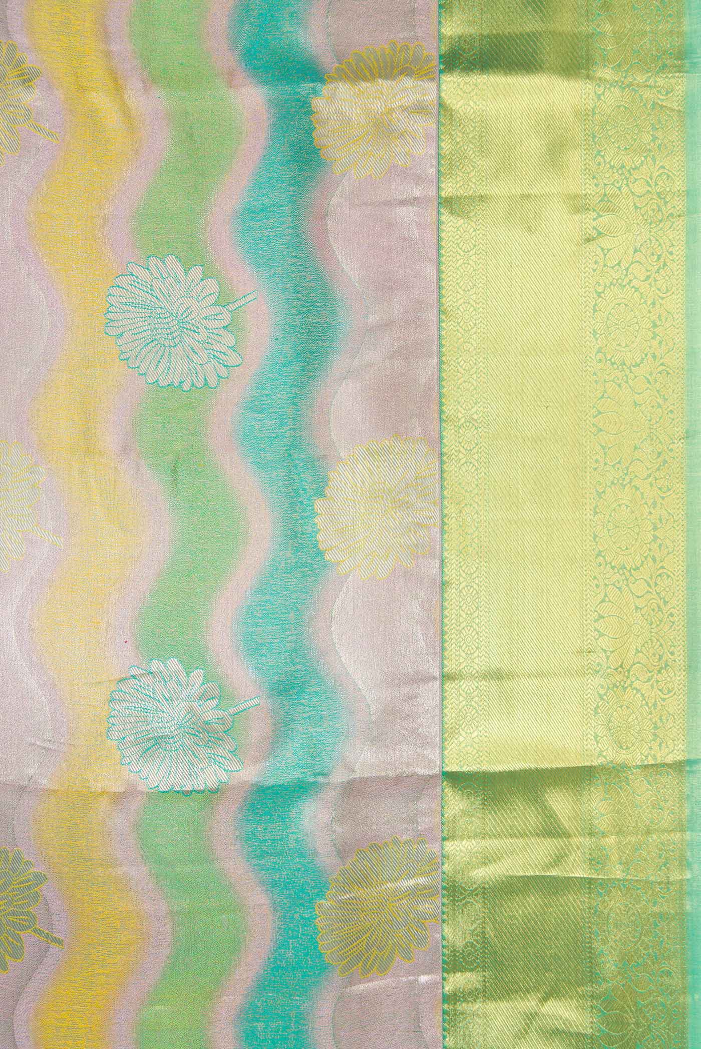 Border image of Green and Lavender Color Kanjivaram Tissue Silk Saree with Zari Brocade on the body and Zari Border. 
