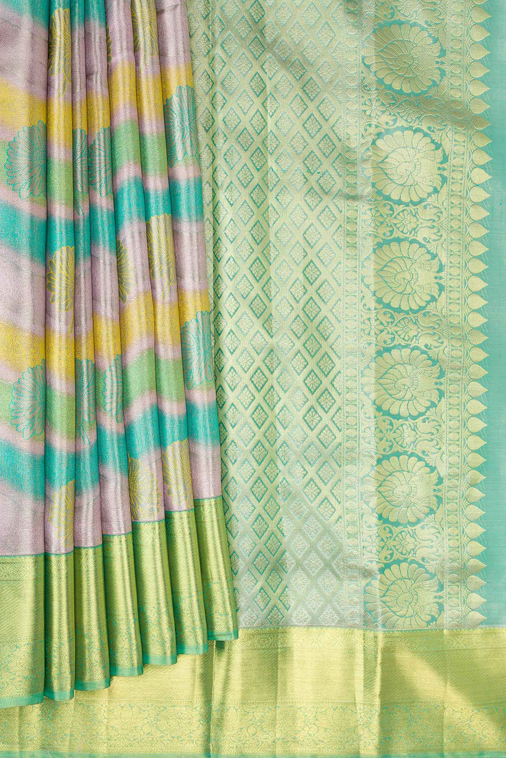 Pleats and pallu of Green and Lavender Color Kanjivaram Tissue Silk Saree with Zari Brocade on the body and Zari Border. 