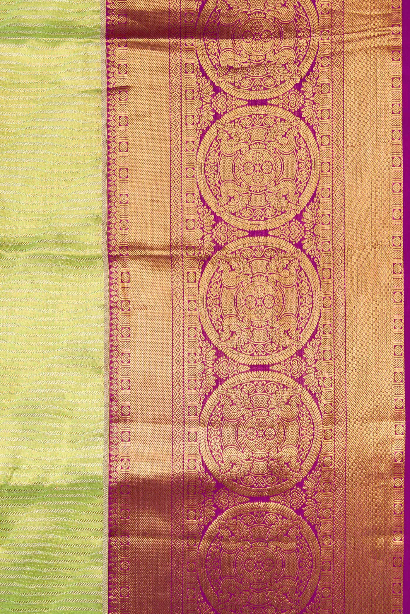 Border image of Parrot Green Dual Tone Kanjivaram Tissue Silk Saree with Zari Brocade on the body and Zari Border. 