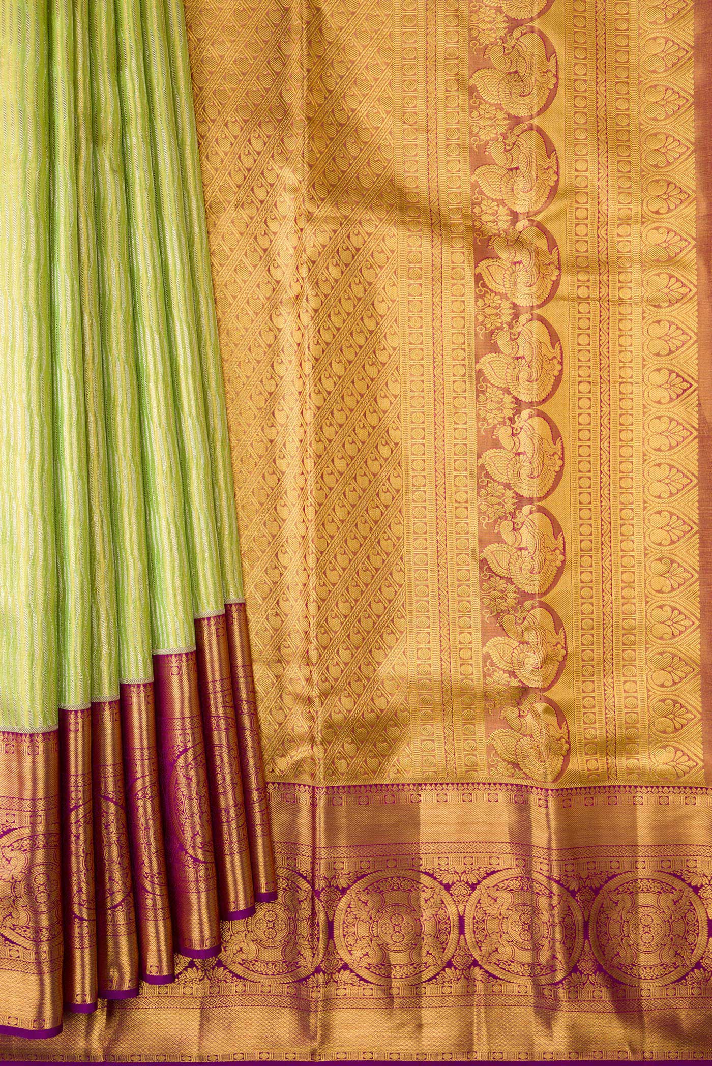 Pleats and pallu of Parrot Green Dual Tone Kanjivaram Tissue Silk Saree with Zari Brocade on the body and Zari Border. 