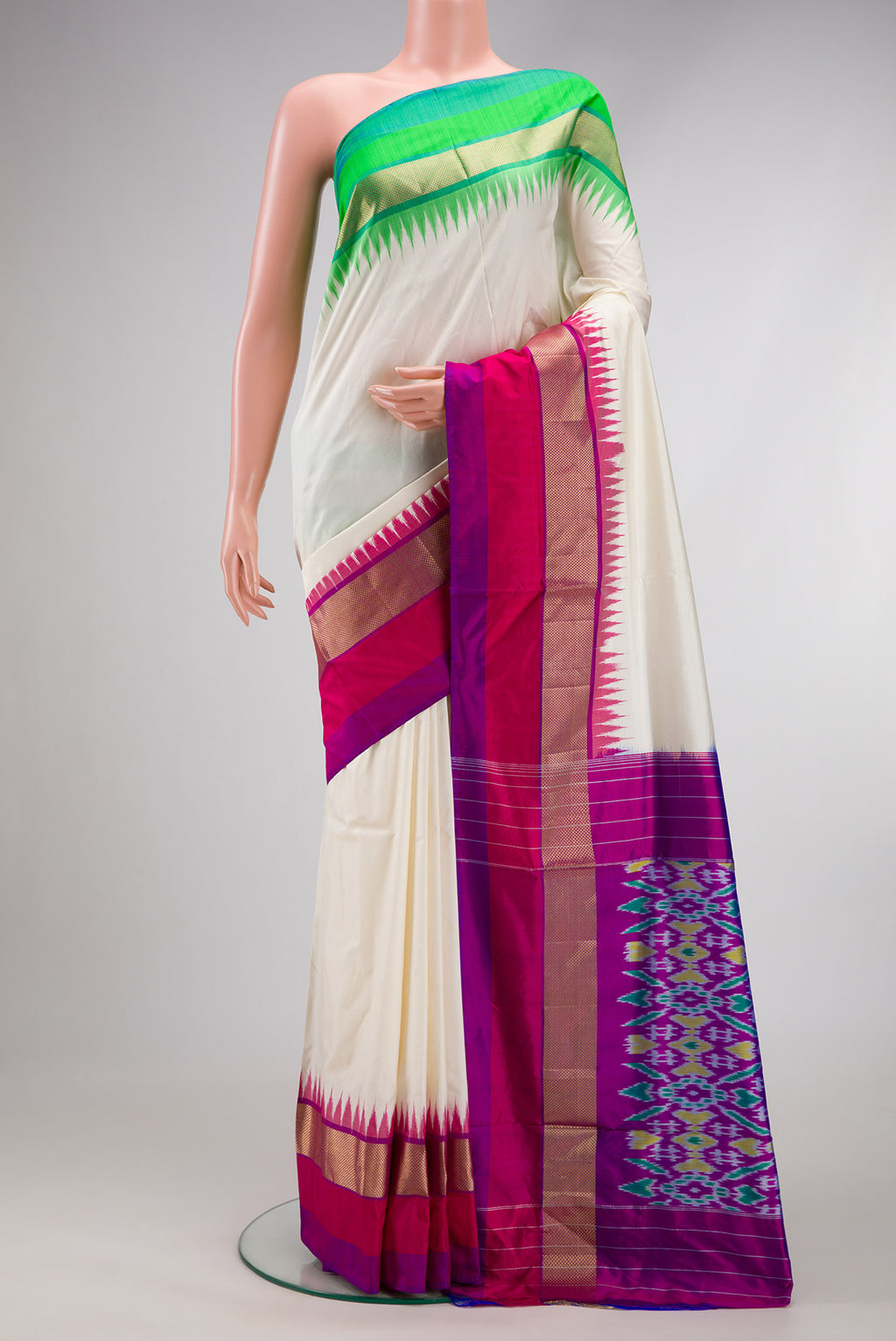 Off White Double Ikat Saree with Plain Body and Ganga Jamuna Border.  displayed on a mannequin