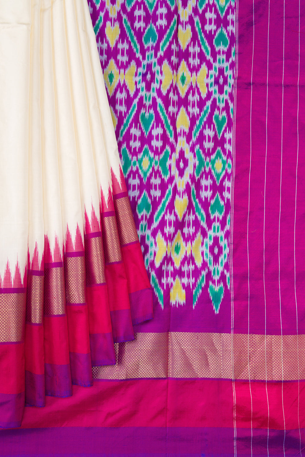 Pleats and pallu of Off White Double Ikat Saree with Plain Body and Ganga Jamuna Border. 