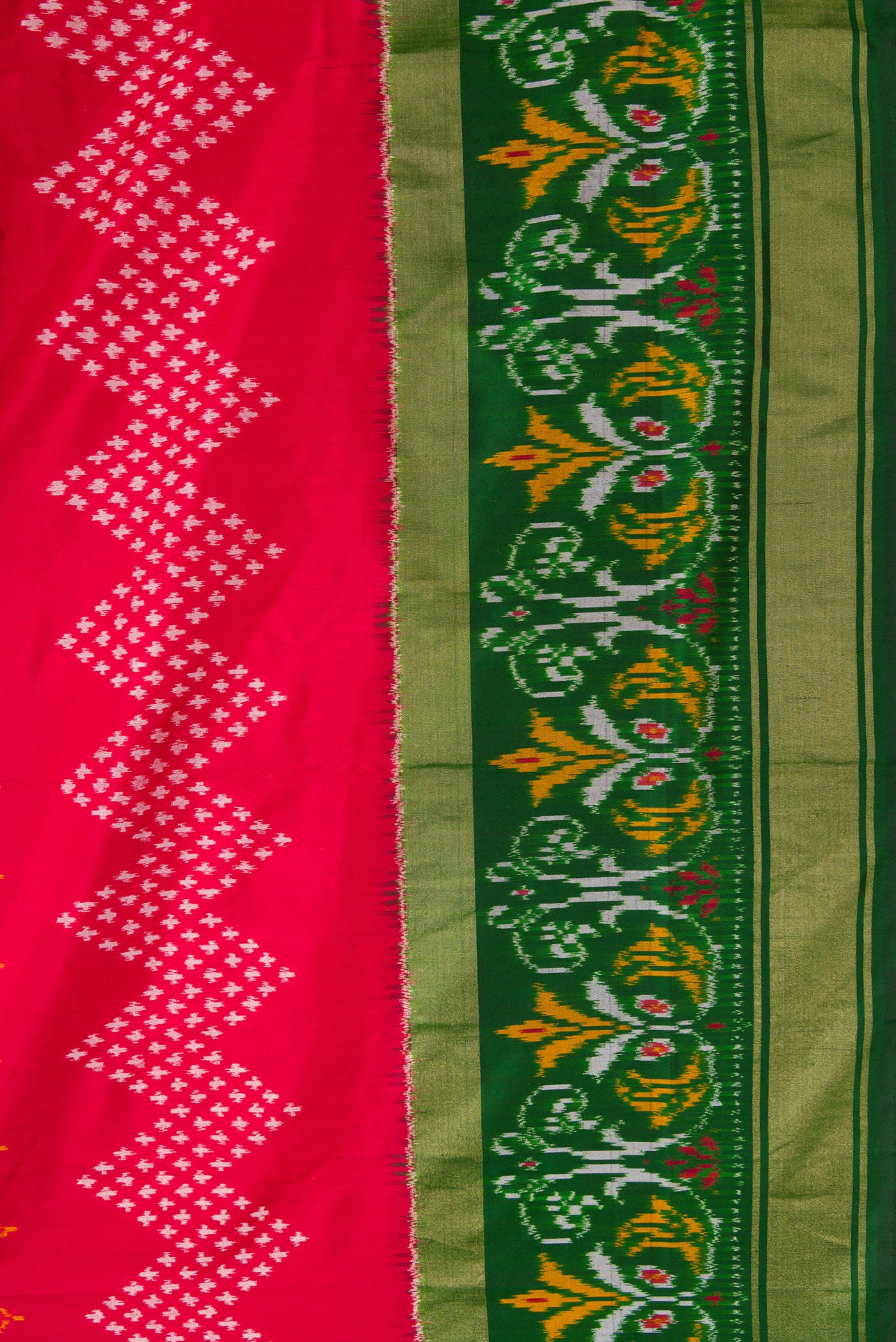 Border image of Red Dual Tone Double Ikat Saree with Ikat Print on the body and Ikat Border. 