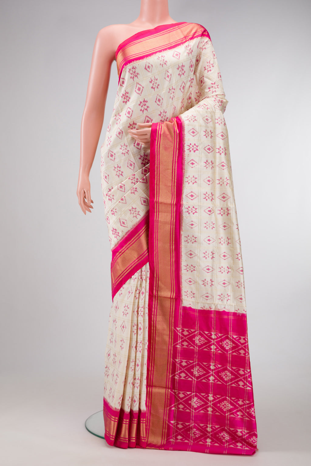 Off White Dual Tone Double Ikat Saree with Ikat Print on the body and Zari Border.  displayed on a mannequin