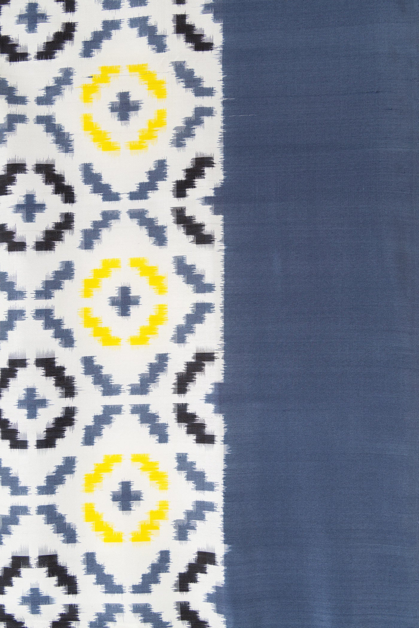 Border image of Off White Dual Tone Double Ikat Saree with Ikat Print on the body and Plain Border. 