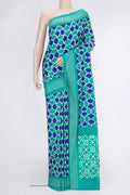 Sea Green Dual Tone Double Ikat Saree with Ikat Print on the body and Plain Border.  displayed on a mannequin