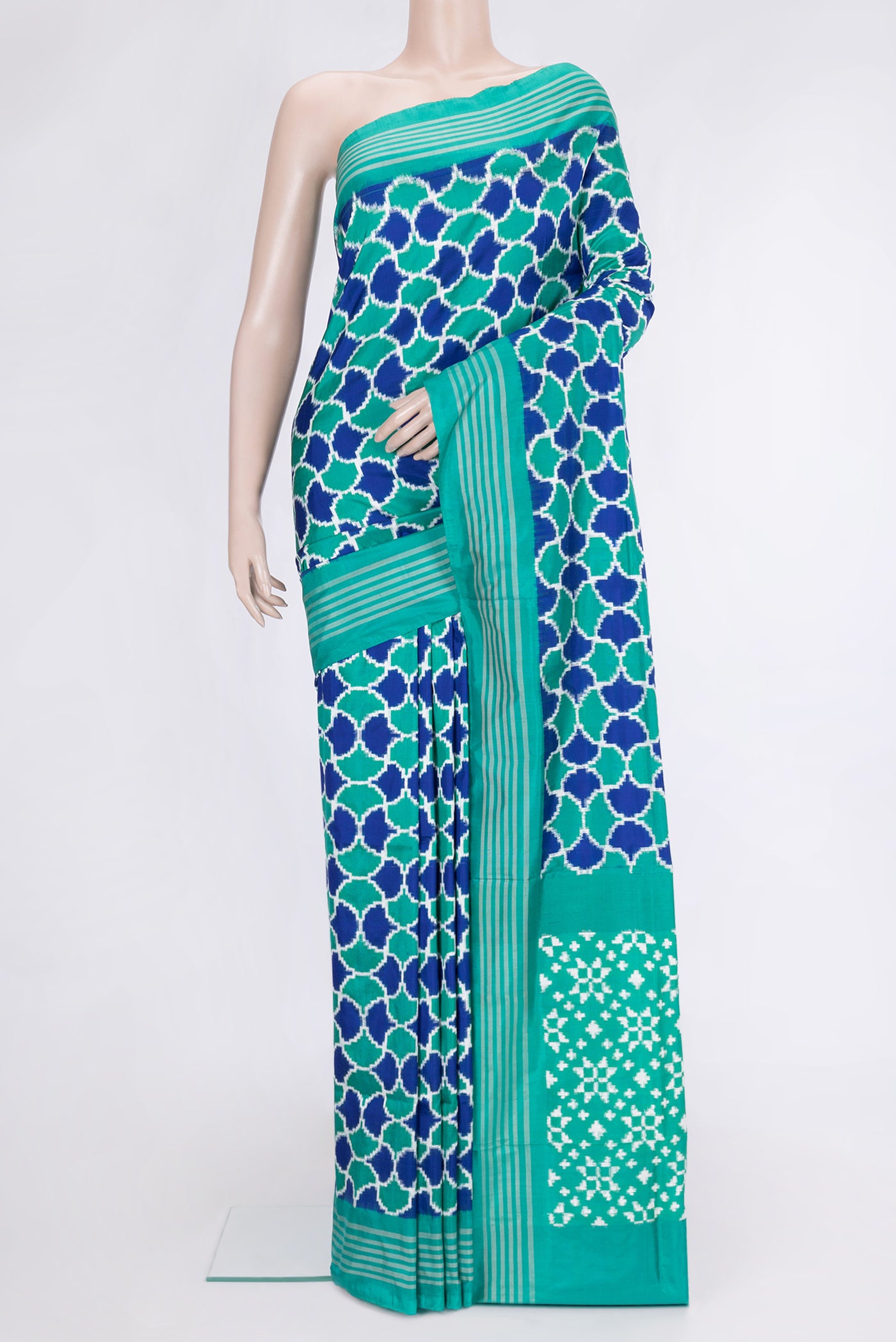 Sea Green Dual Tone Double Ikat Saree with Ikat Print on the body and Plain Border.  displayed on a mannequin