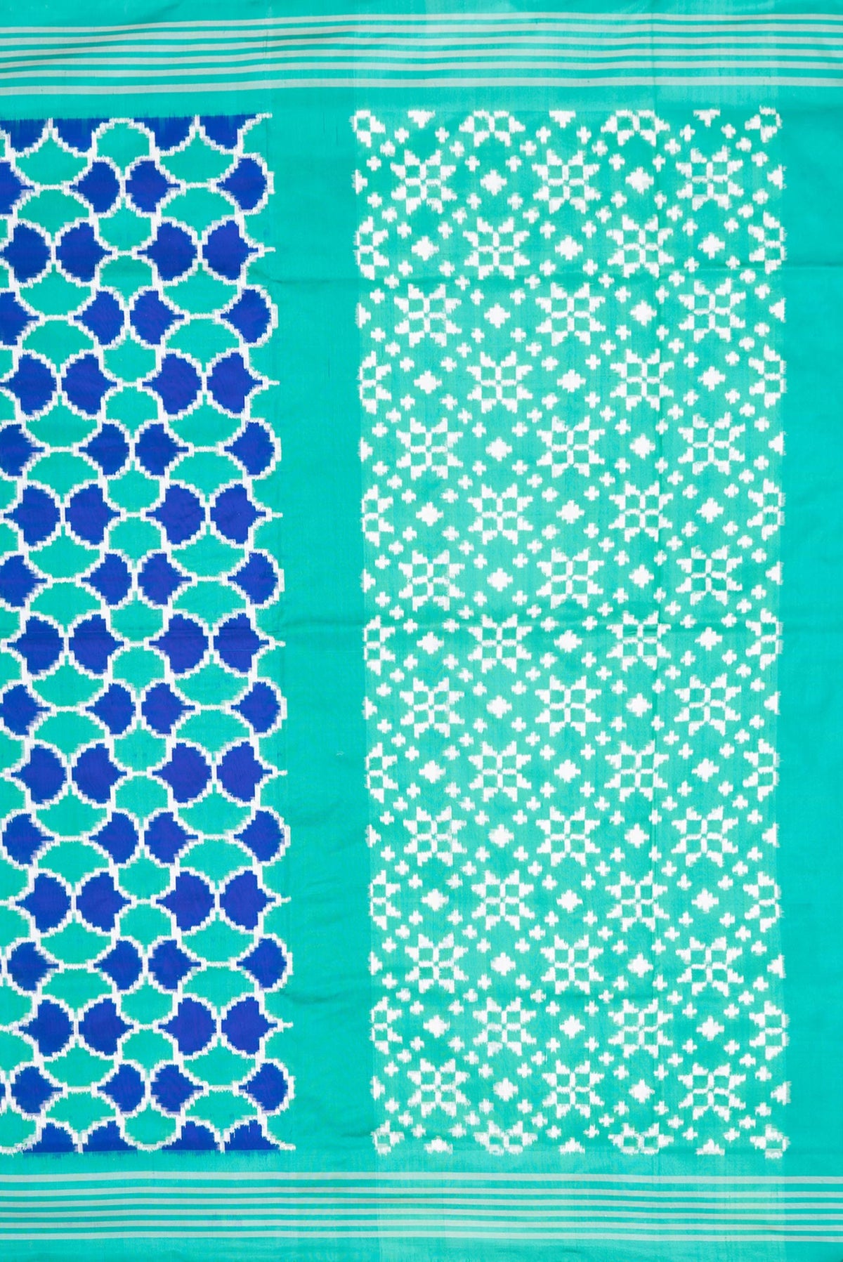 Close up image of the pallu of Sea Green Dual Tone Double Ikat Saree with Ikat Print on the body and Plain Border. 