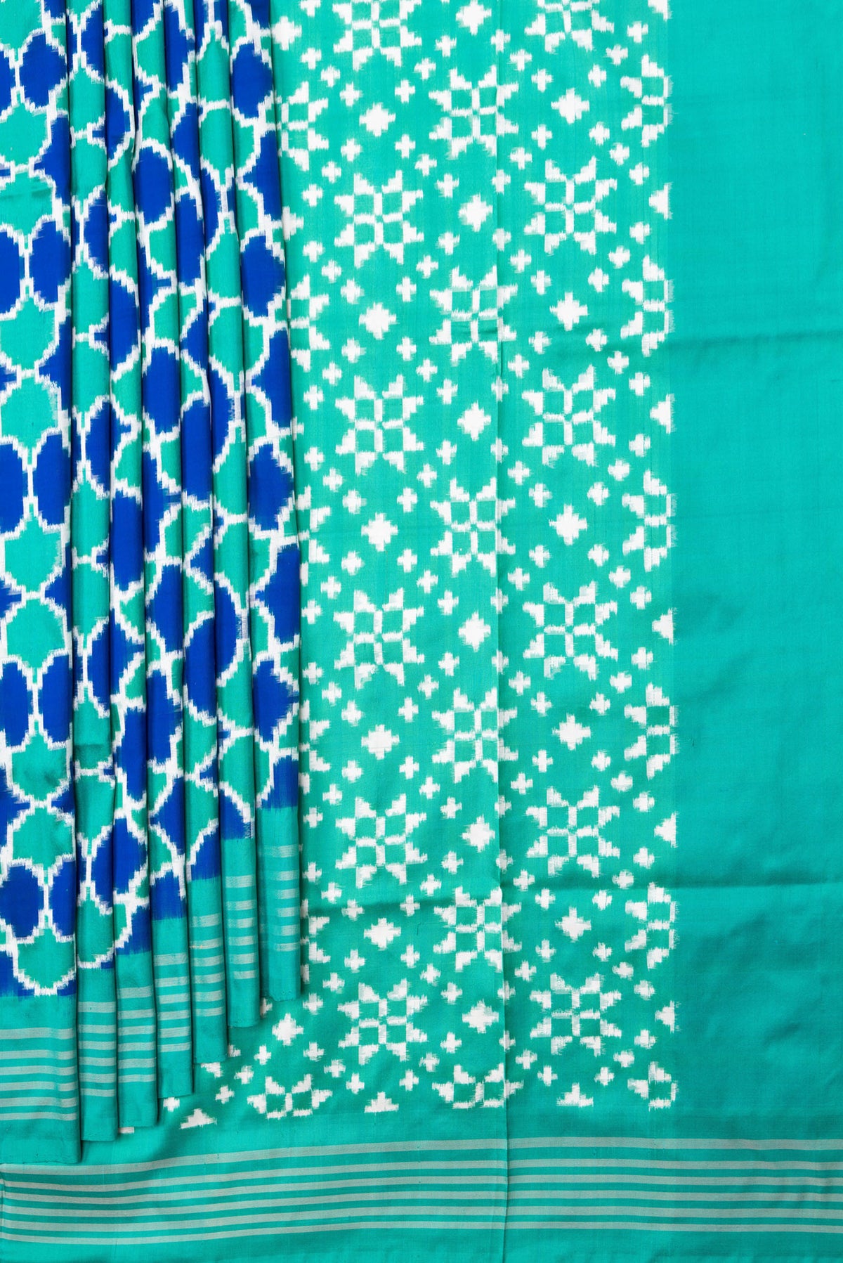 Pleats and pallu of Sea Green Dual Tone Double Ikat Saree with Ikat Print on the body and Plain Border. 