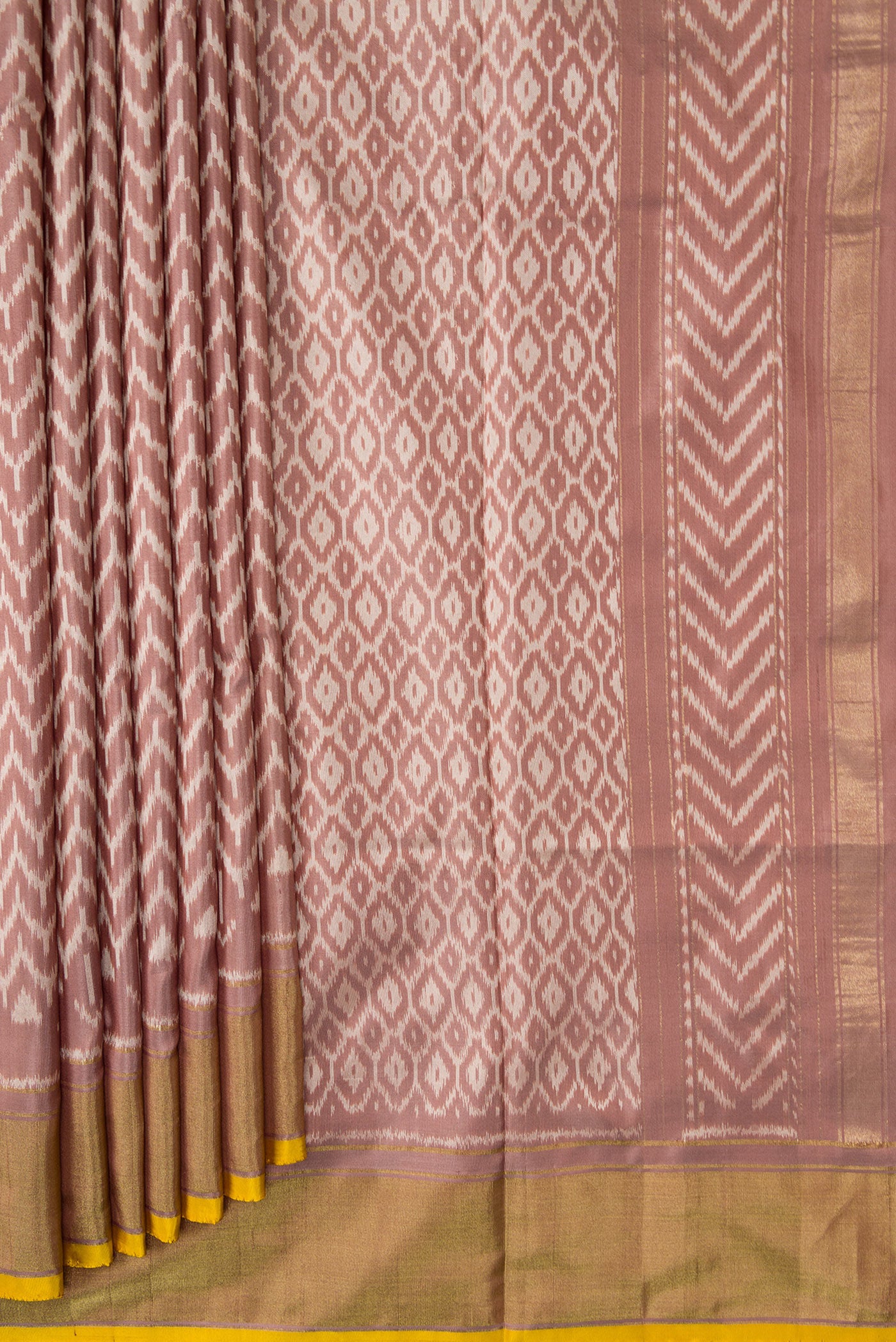 Pleats and pallu of Brown Dual Tone Double Ikat Saree with Ikat Print on the body and Zari Border. 
