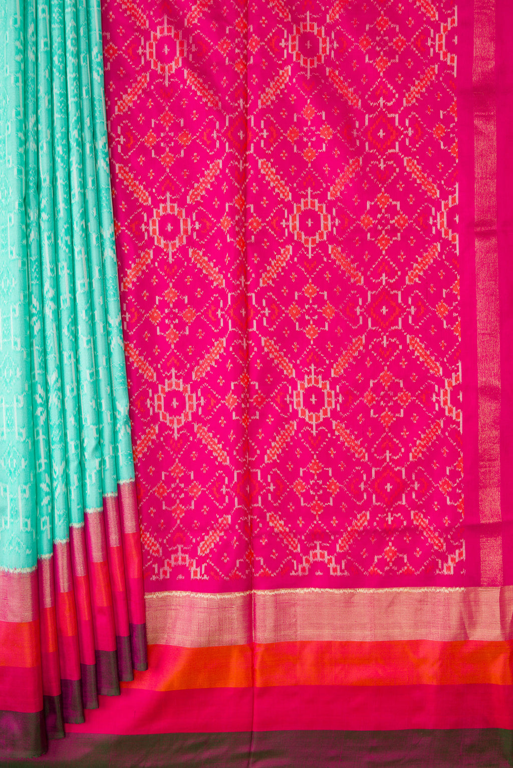 Pleats and pallu of Sea Green Dual Tone Double Ikat Saree with Ikat Print on the body and Zari Border. 