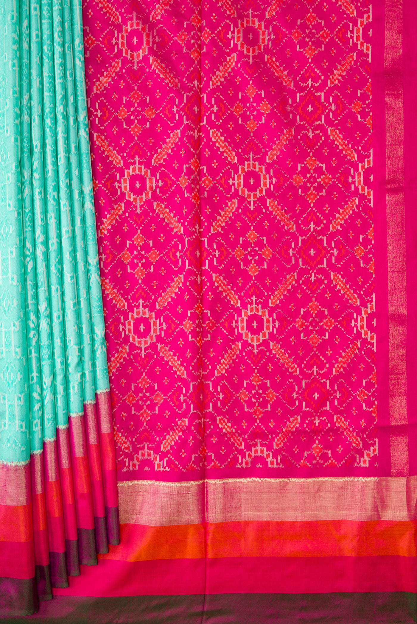 Pleats and pallu of Sea Green Dual Tone Double Ikat Saree with Ikat Print on the body and Zari Border. 