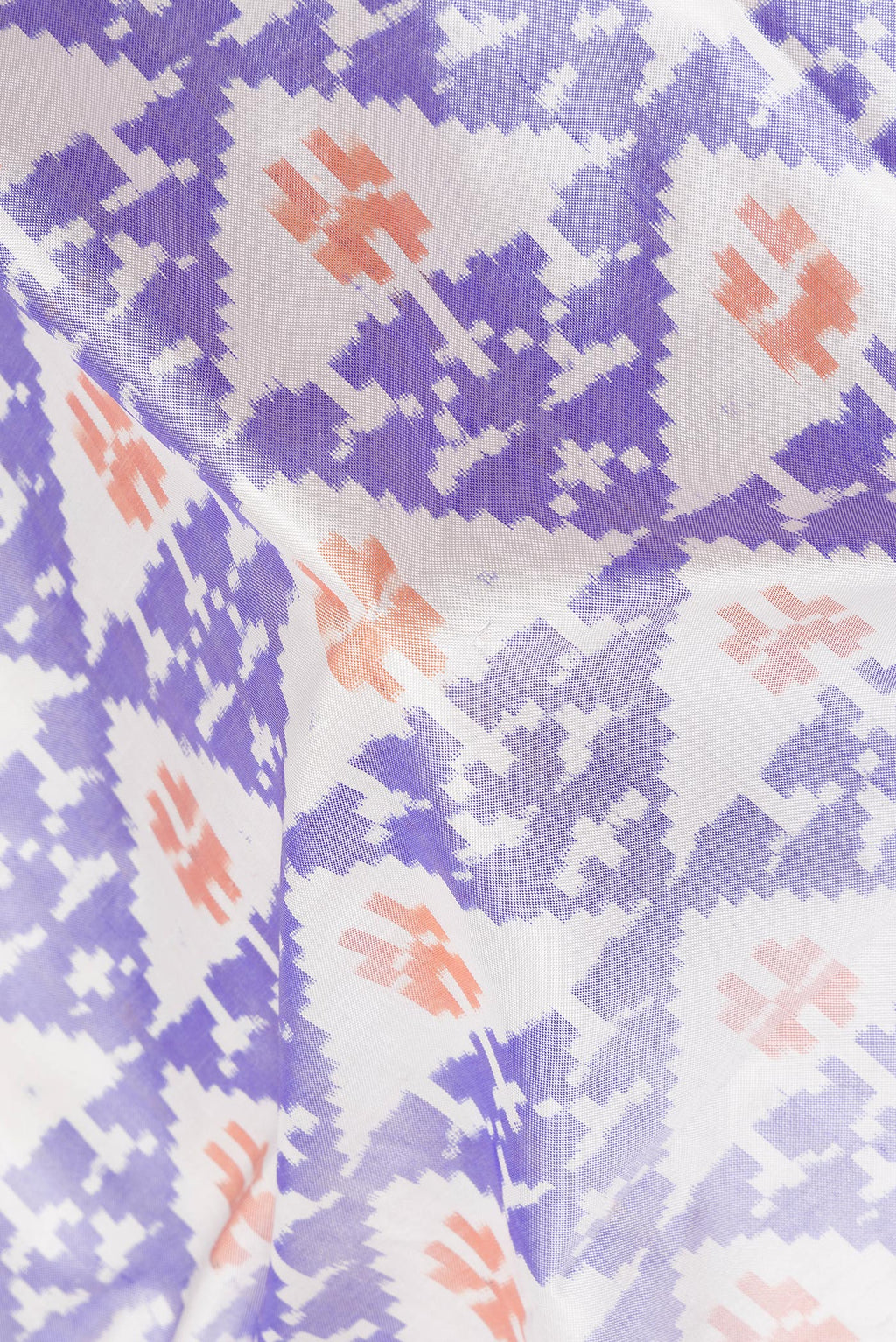 Close up of Pure Silk Off White Pochampally Saree with Pure Ikat on the body and Plain Border.  displaying folds