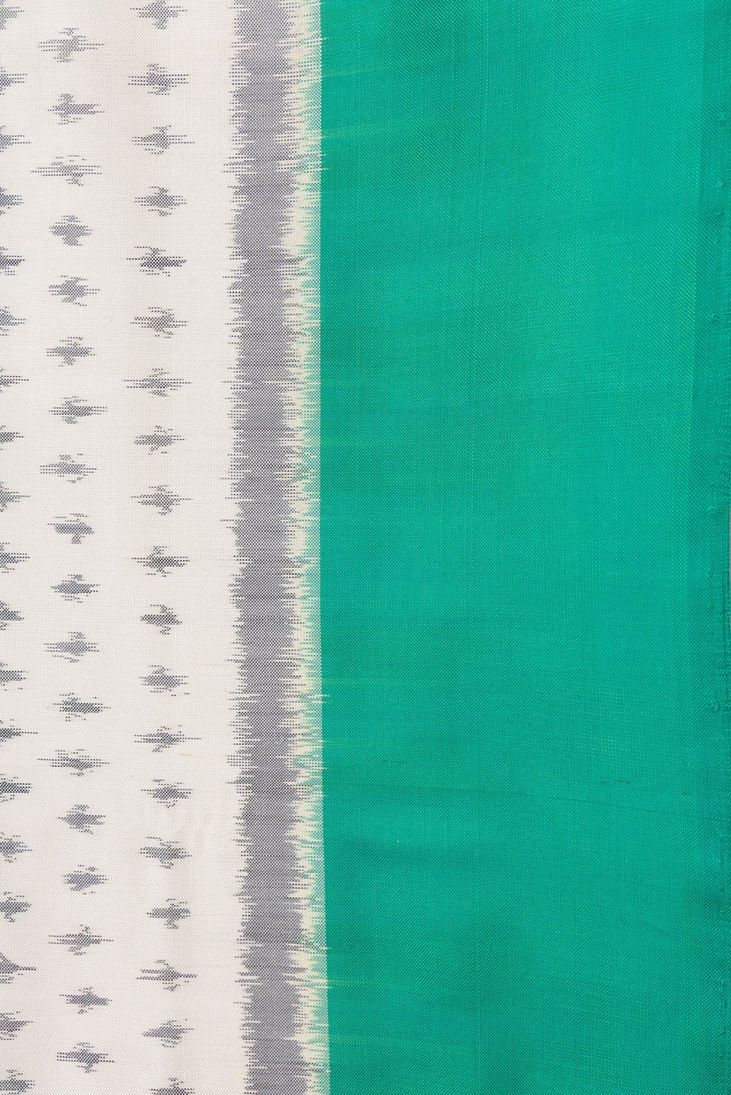 Border image of Off White Dual Tone Double Ikat Saree with Ikat Print on the body and Plain Border. 