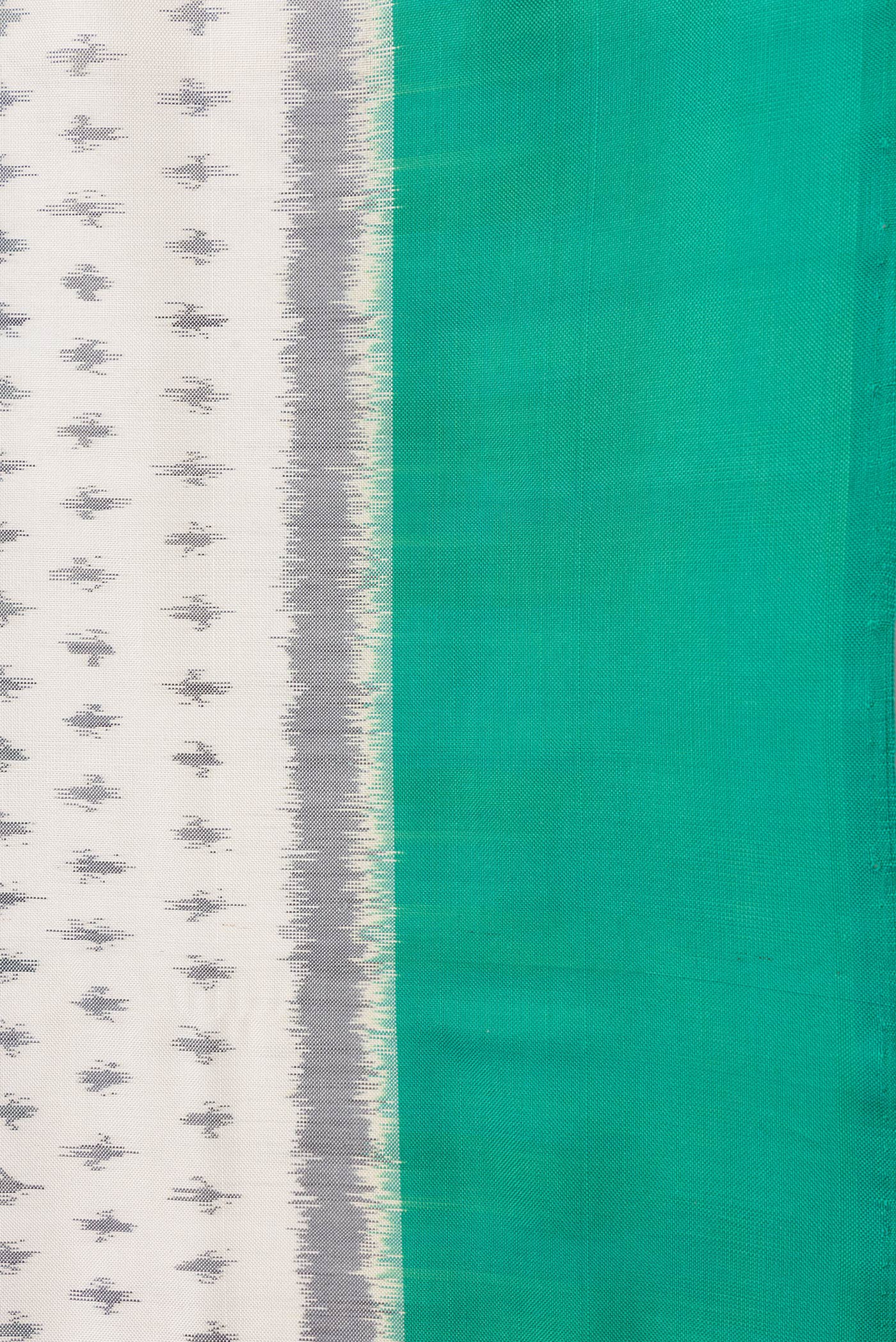 Border image of Off White Dual Tone Double Ikat Saree with Ikat Print on the body and Plain Border. 