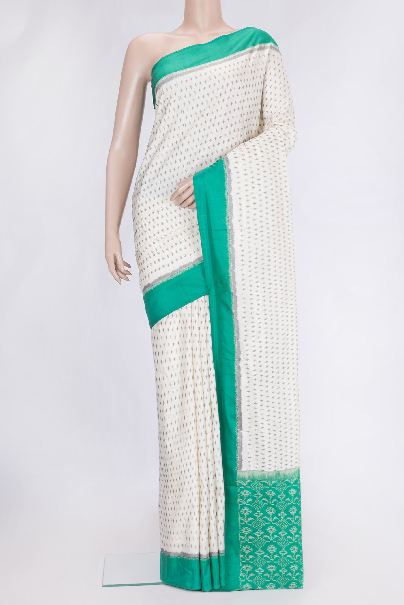 Off White Dual Tone Double Ikat Saree with Ikat Print on the body and Plain Border.  displayed on a mannequin